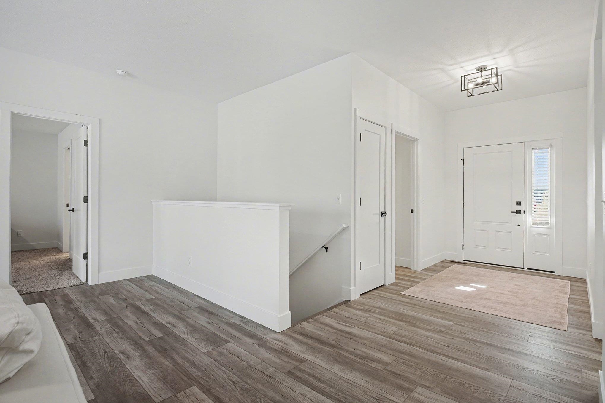 Entrance foyer with wood finished floors