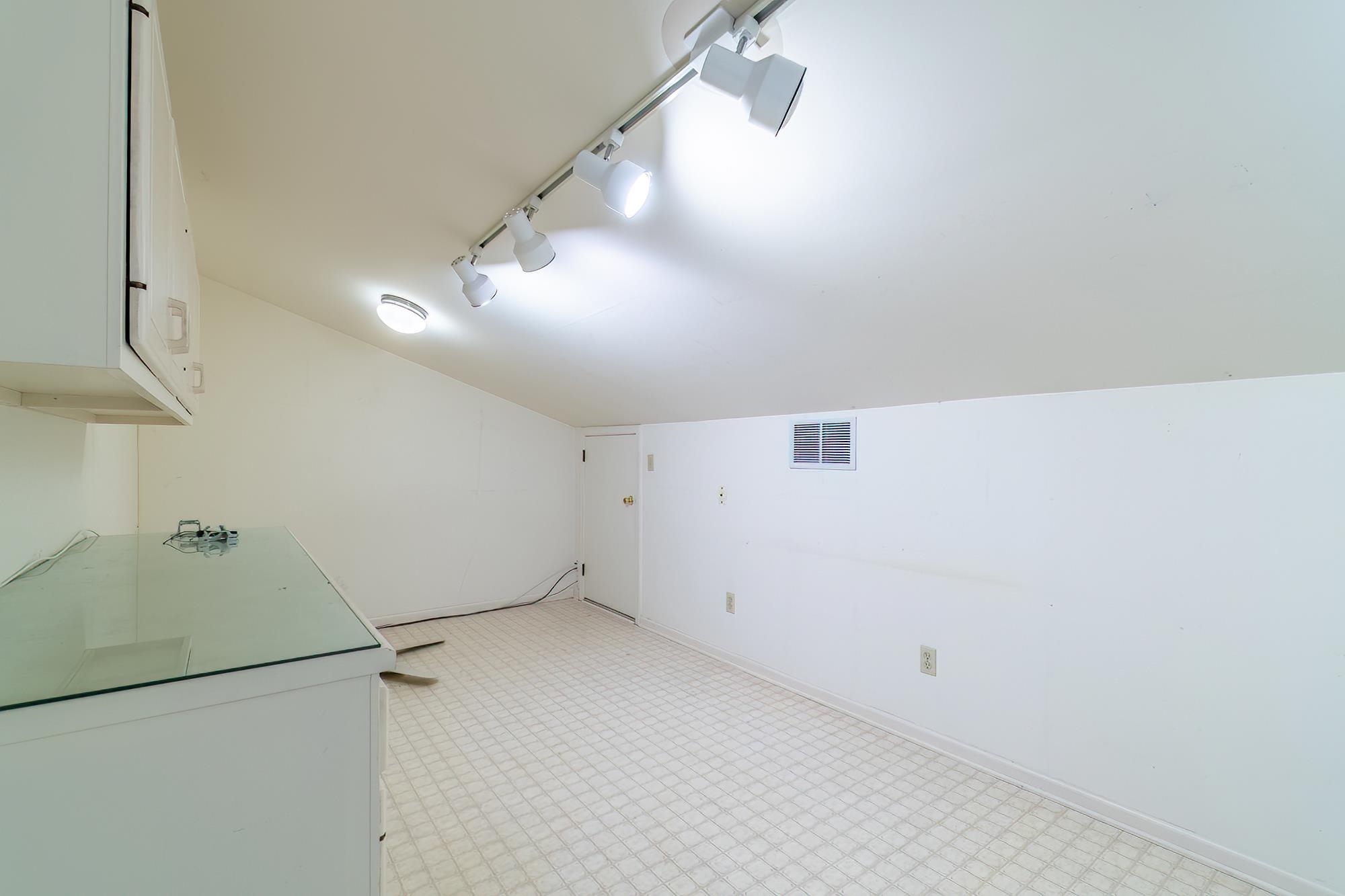 Hobby area with light floors and track lighting