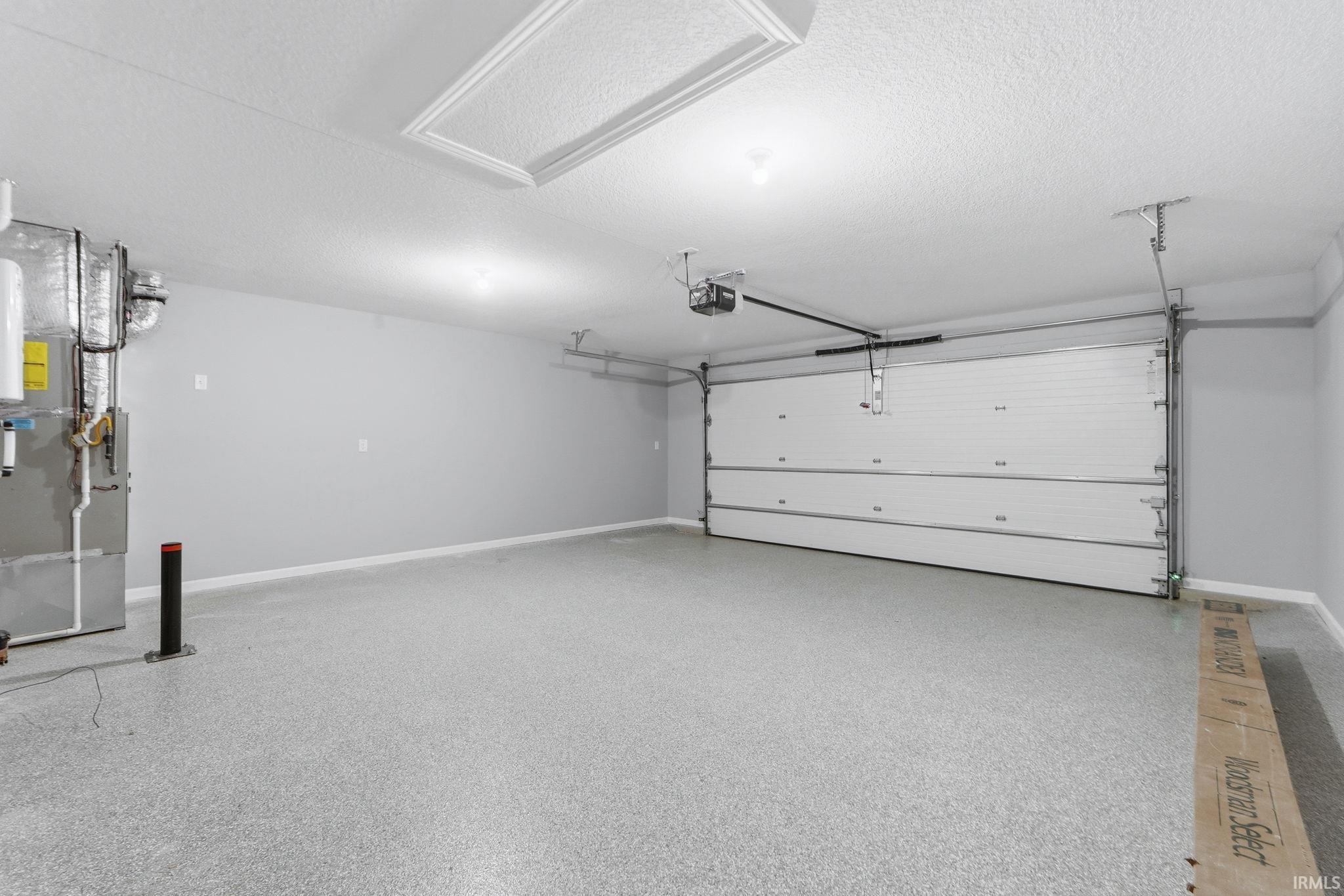 Garage with heating unit and baseboards