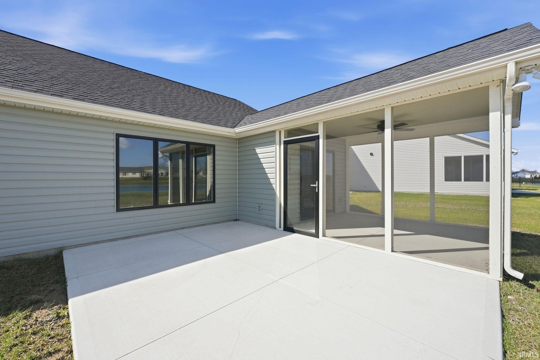 View of patio featuring ceiling fan
