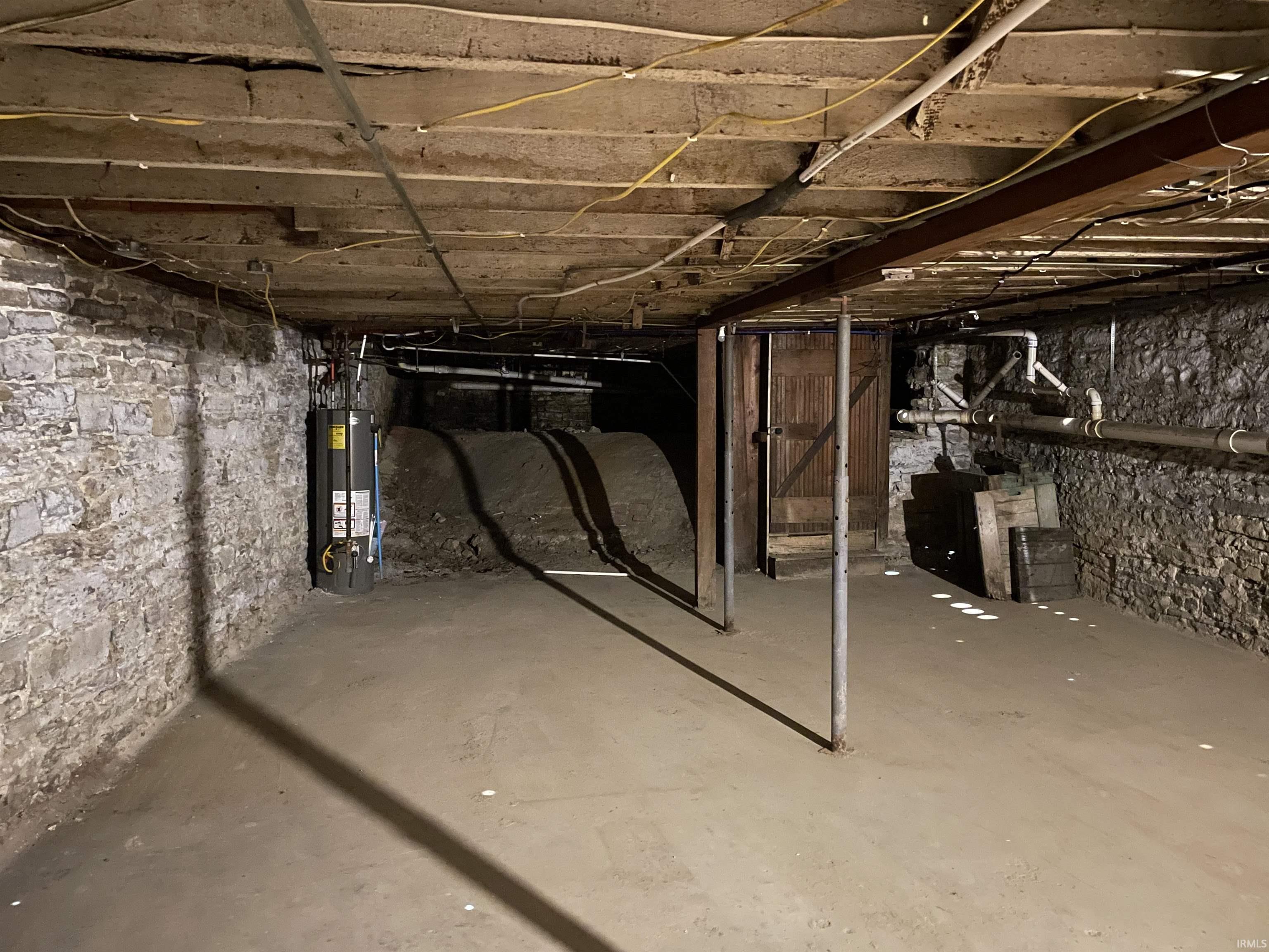 Unfinished below grade area with gas water heater