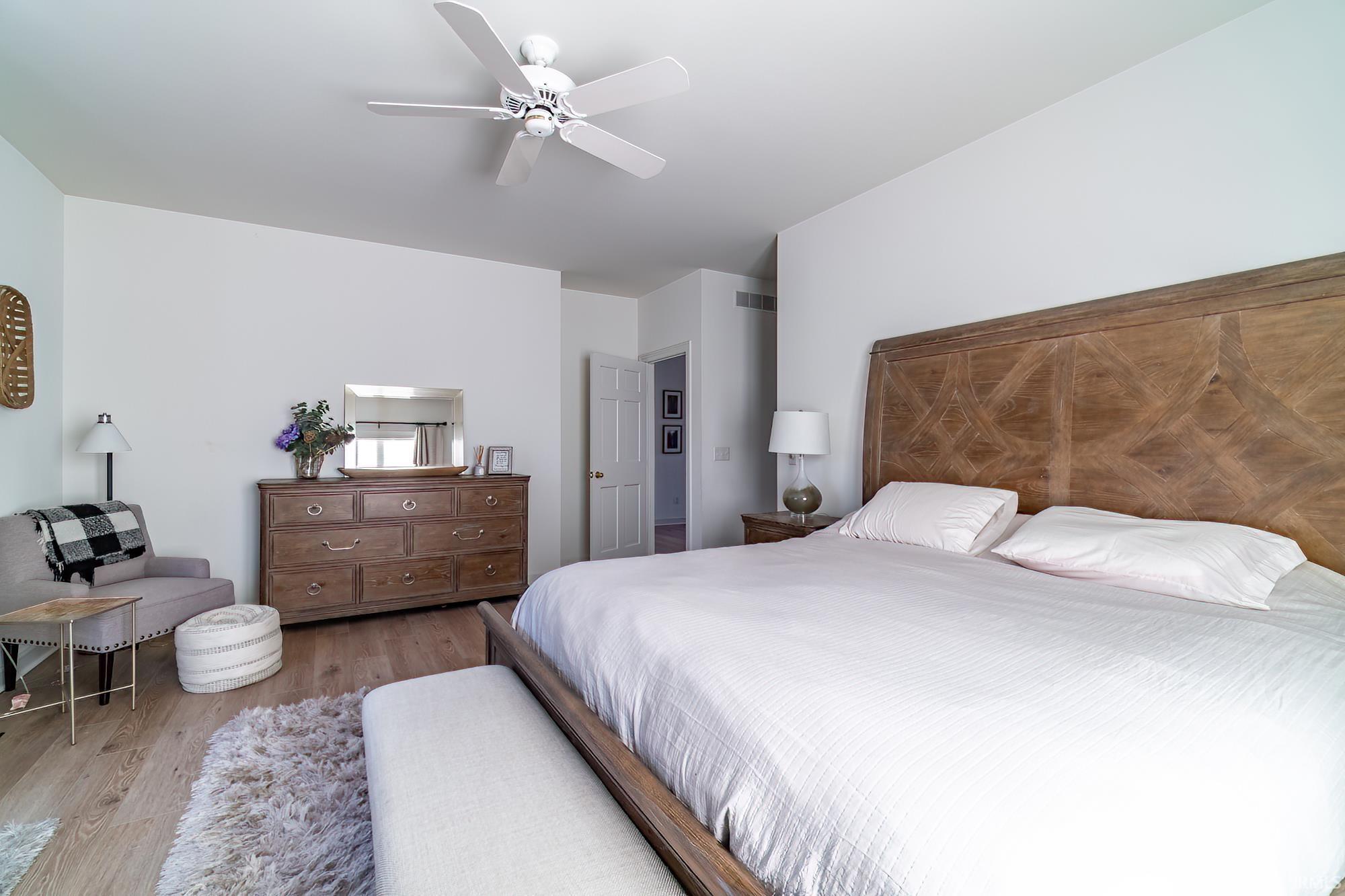 Bedroom featuring wood finished floors and ceiling fan