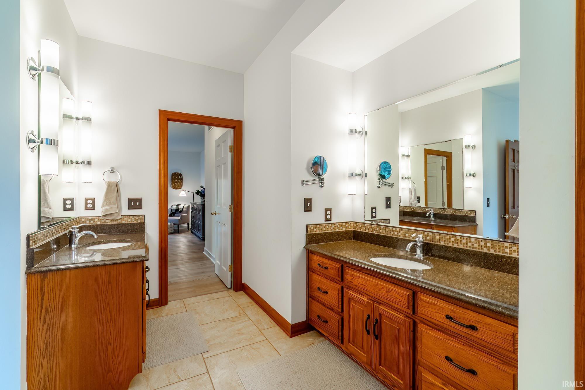 Bathroom featuring vanity and light tile patterned floors