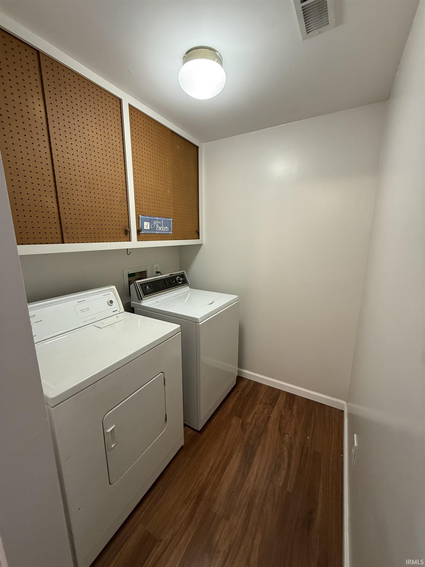 Washroom with independent washer and dryer and cabinet space