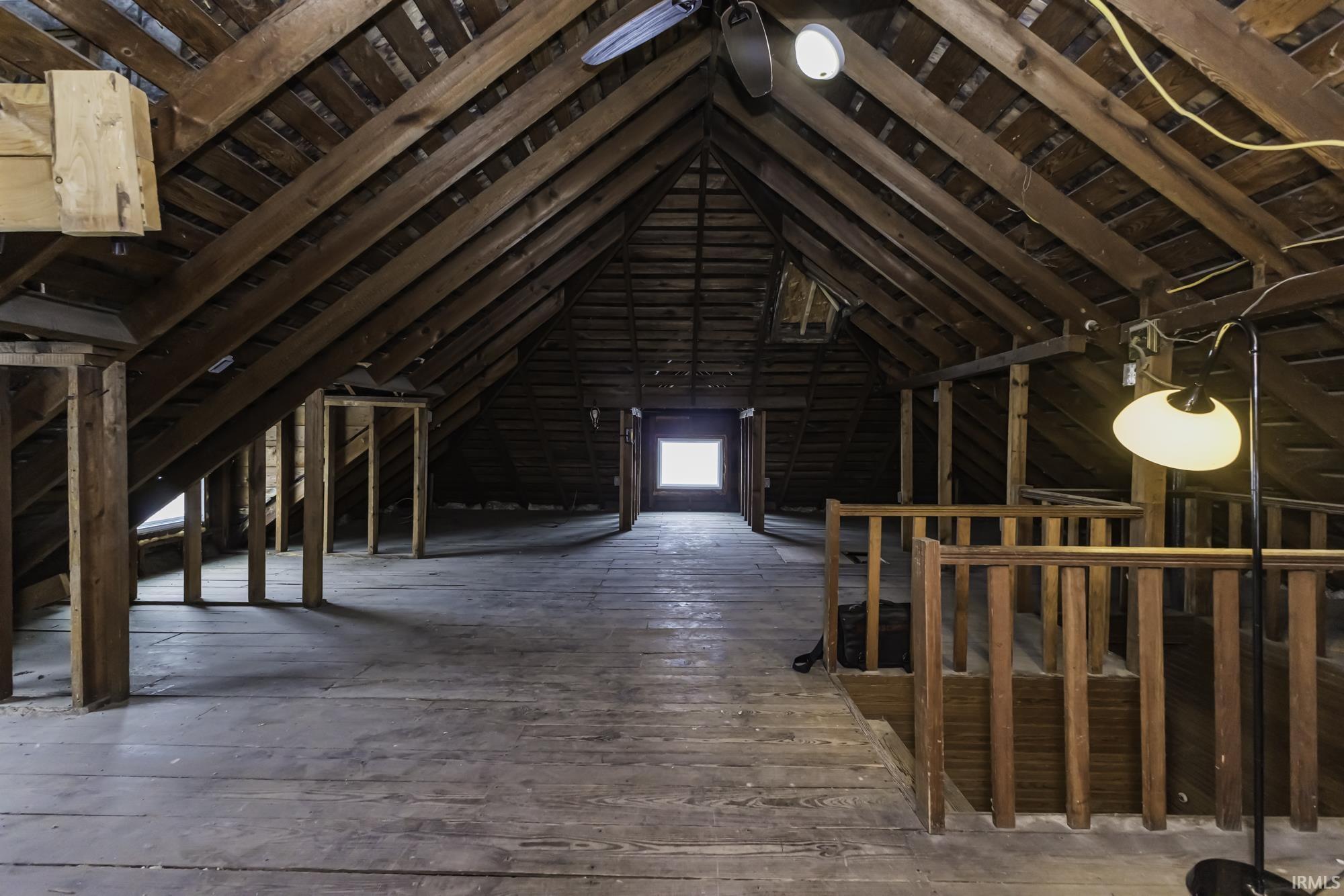 Attic featuring an upstairs landing