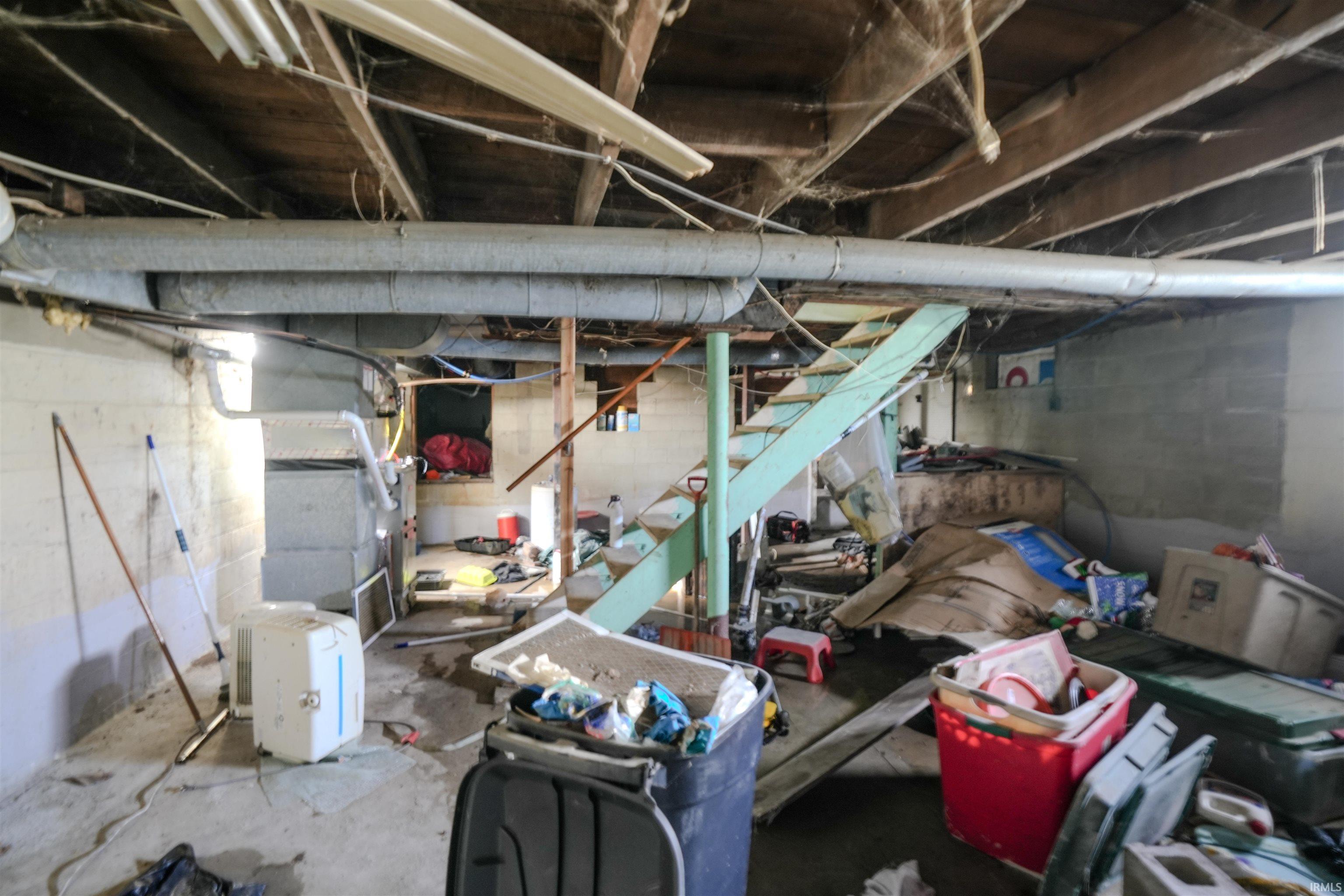 Unfinished basement with stairway