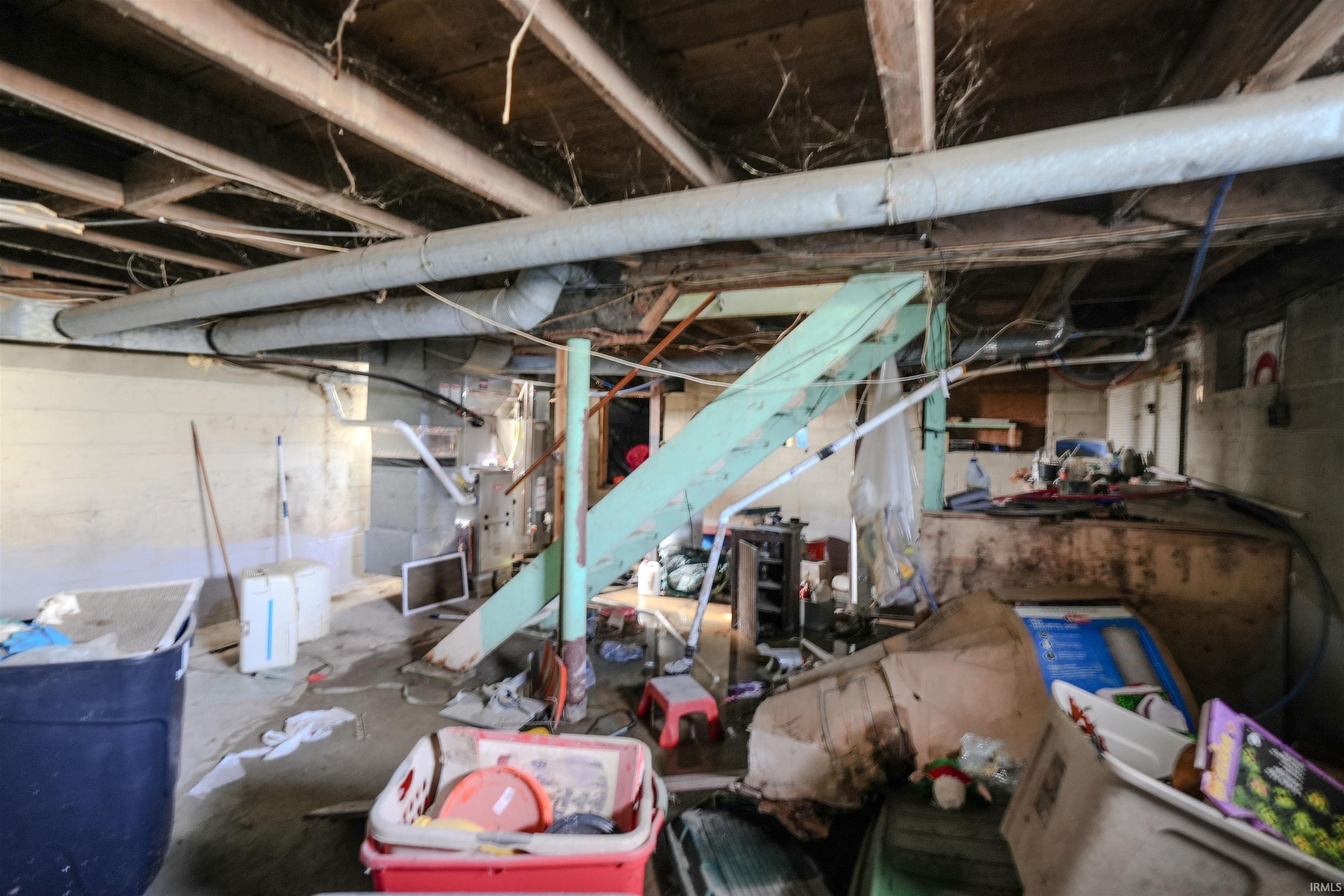 Unfinished basement with stairway