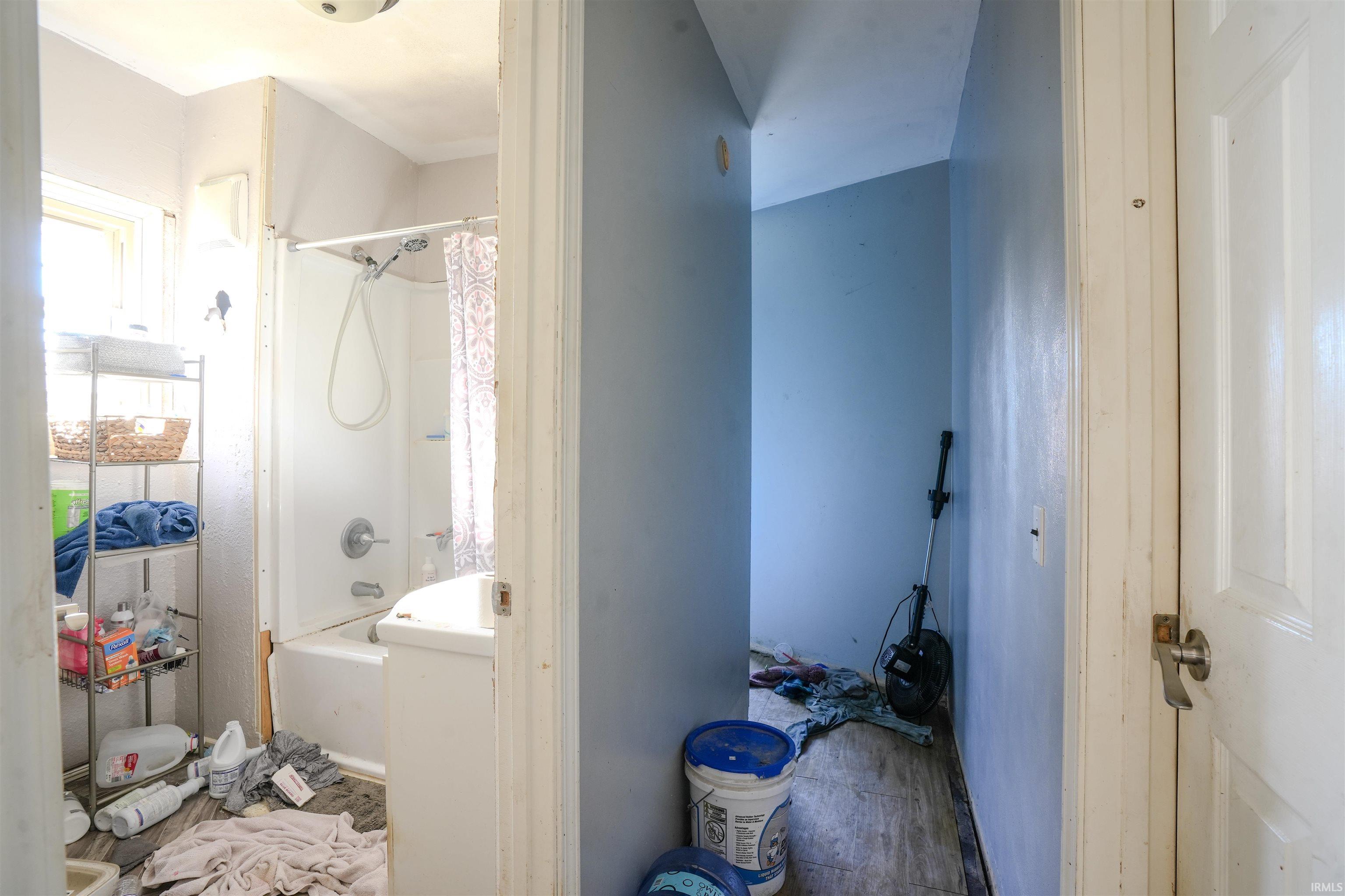 Bathroom with shower / bath combo with shower curtain