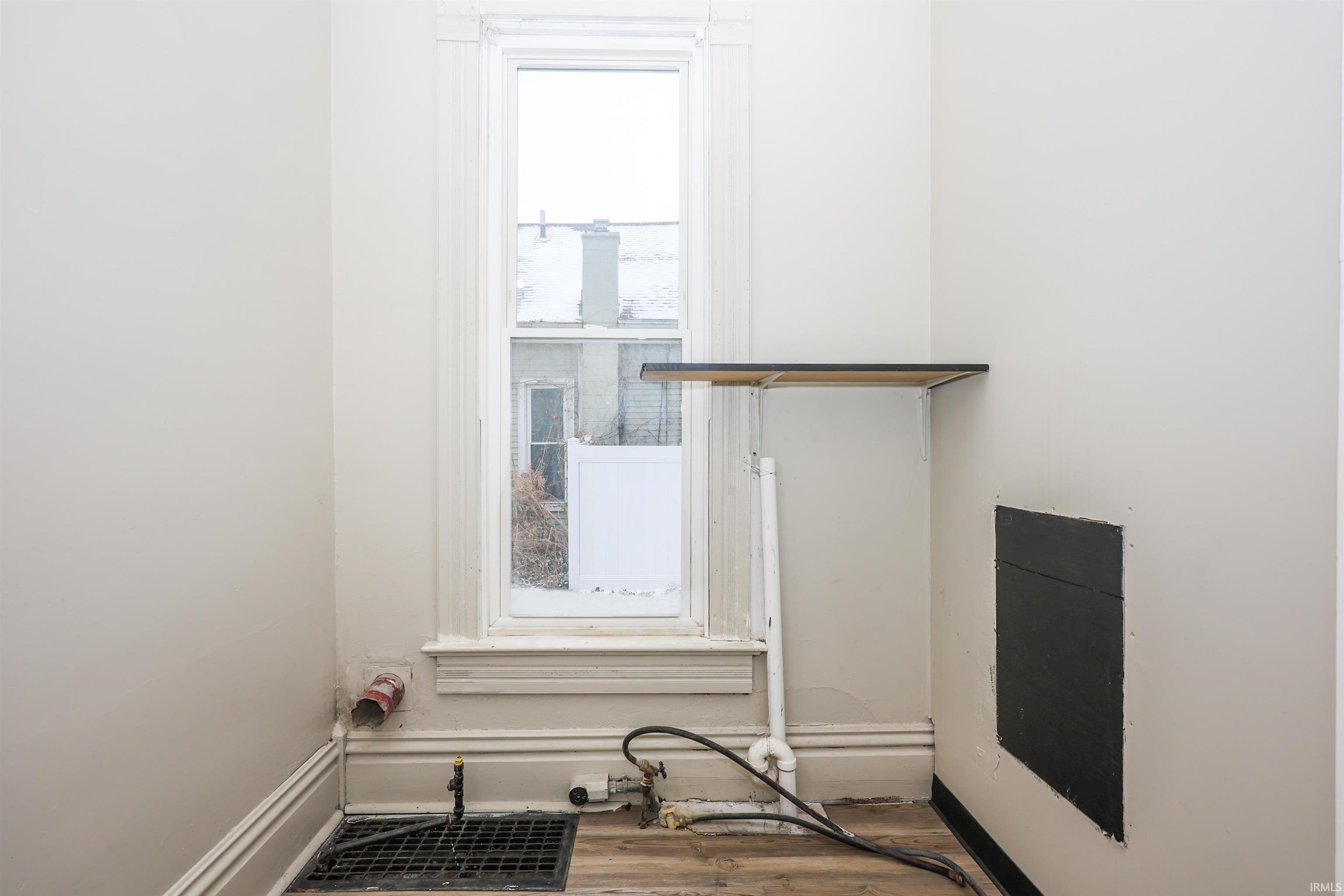 Detailed view of wood finished floors and baseboards