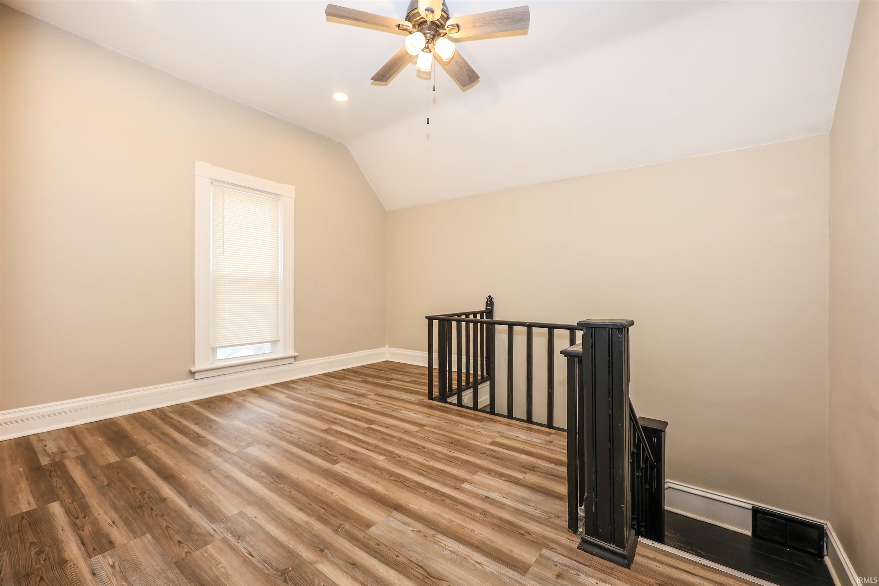 Bonus room featuring vaulted ceiling, ceiling fan, light wood-style floors, and recessed lighting