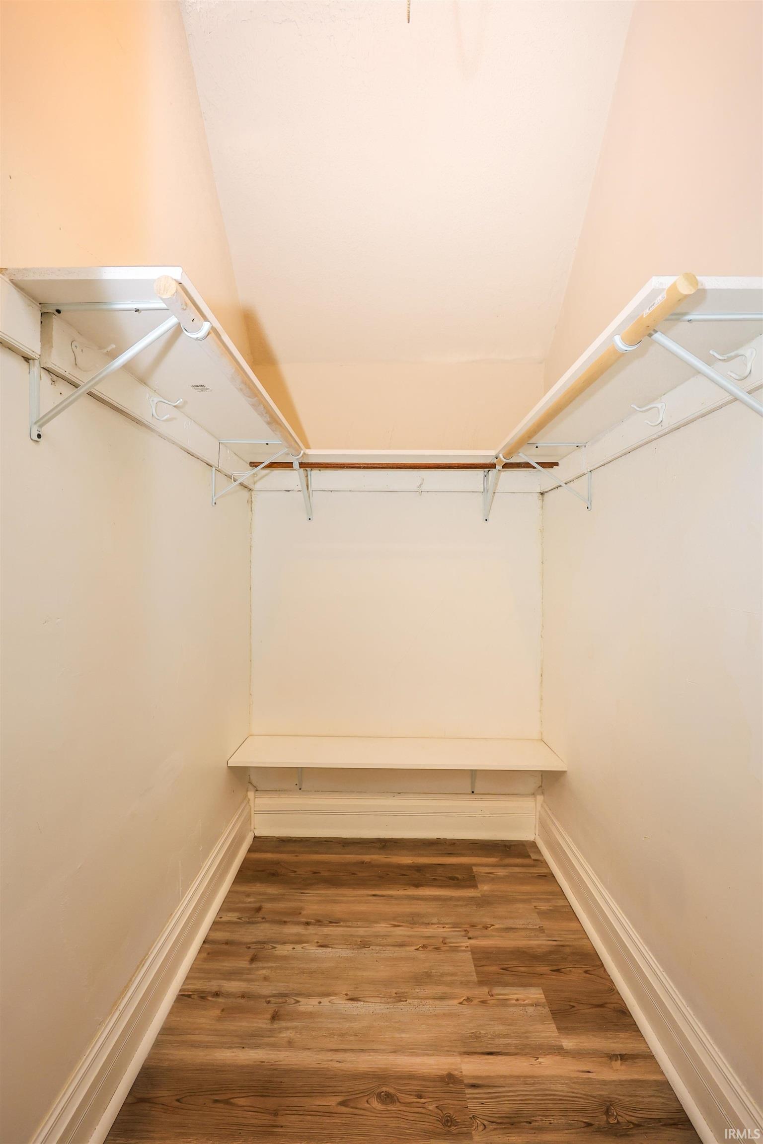 Spacious closet featuring light wood-type flooring