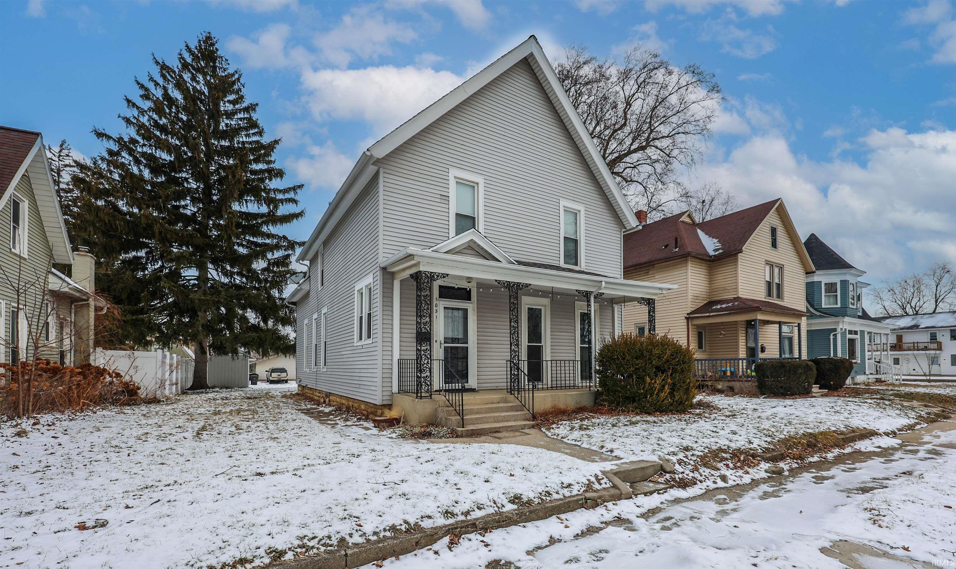 View of front facade featuring covered porch