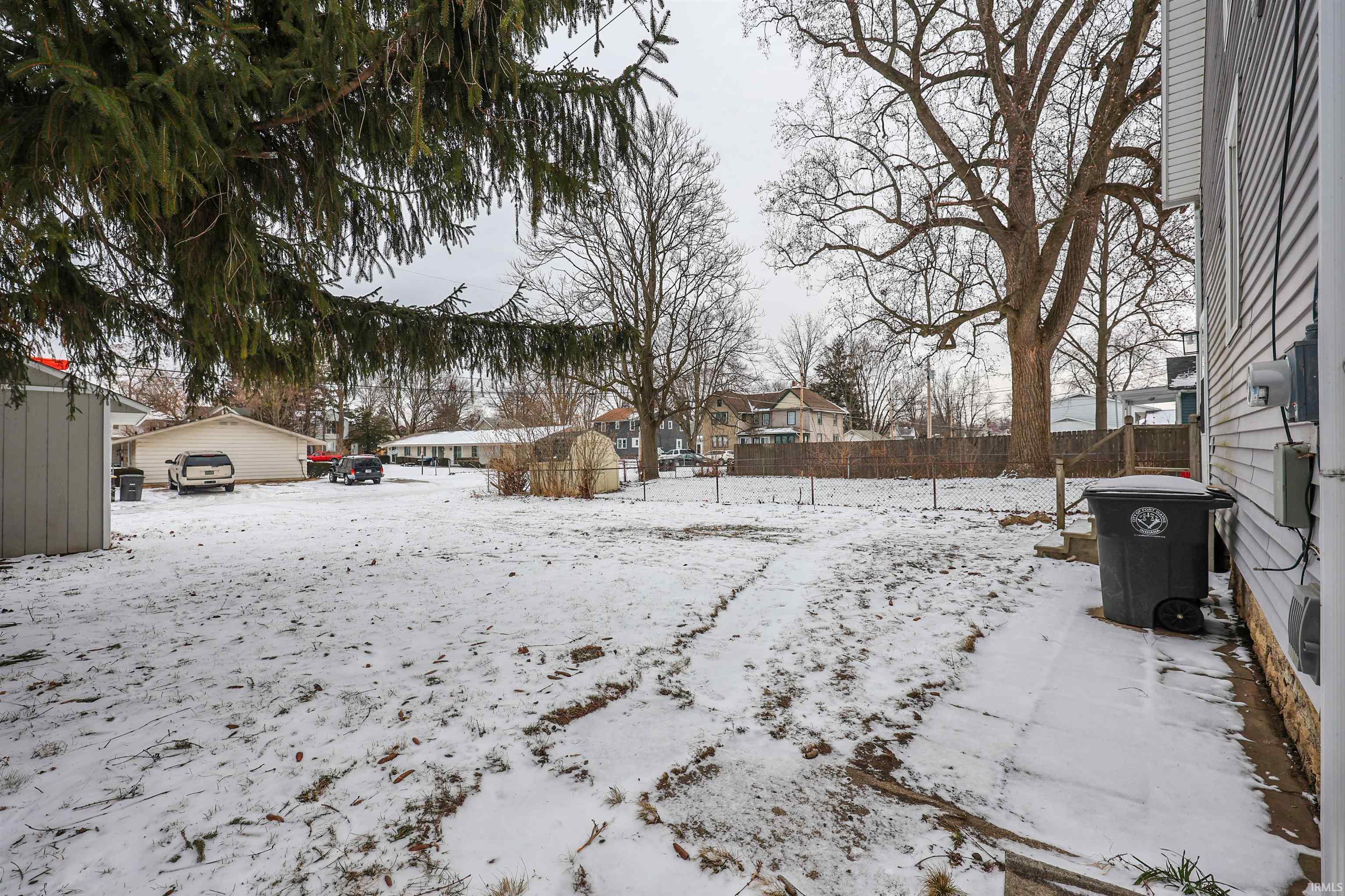 View of yard layered in snow