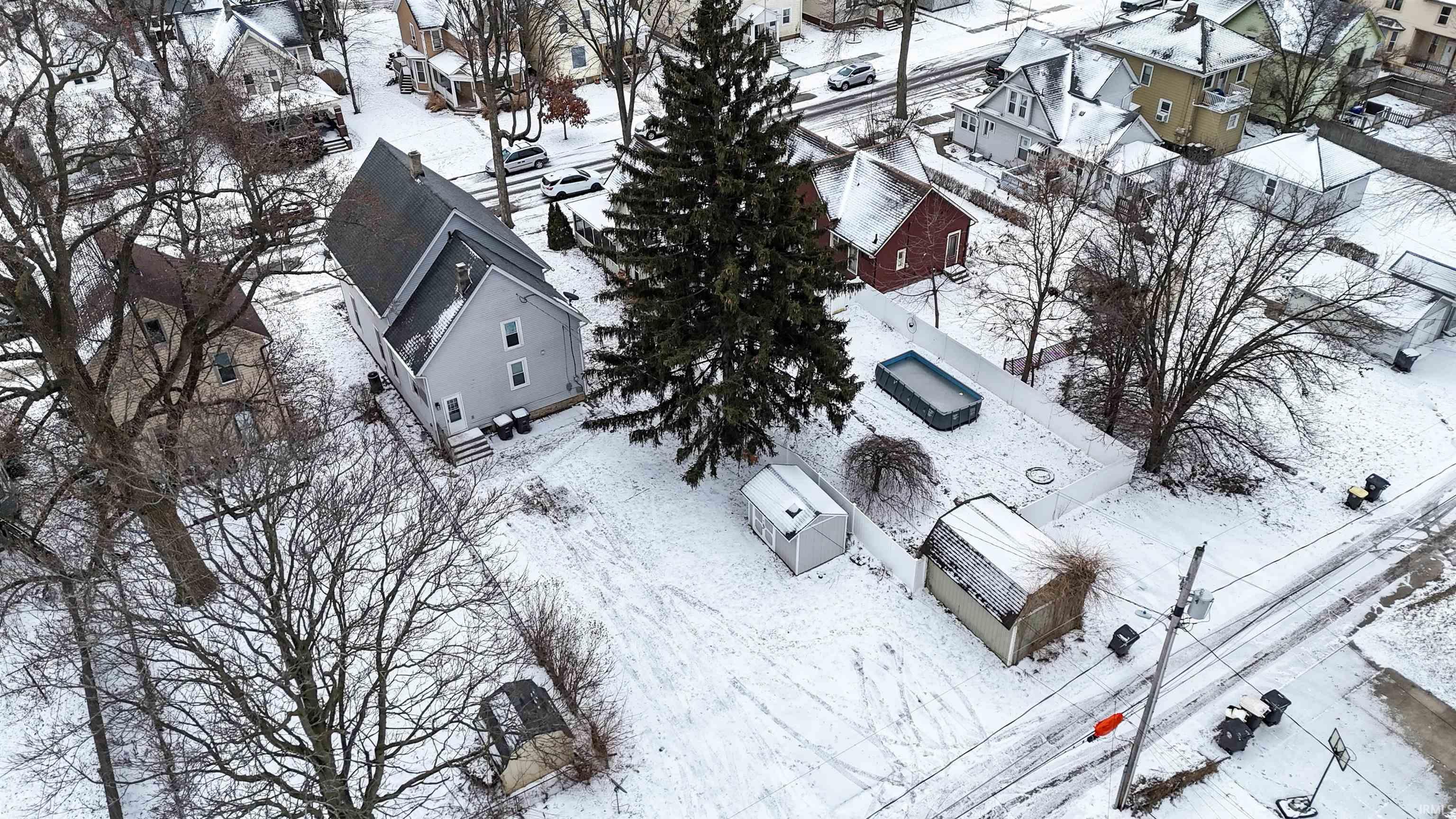 Snowy aerial view with a residential view