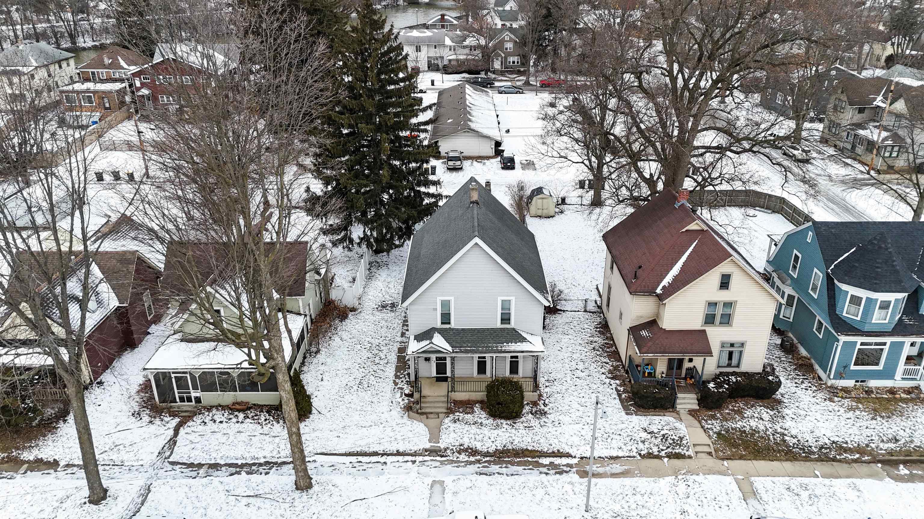 Snowy aerial view featuring a residential view