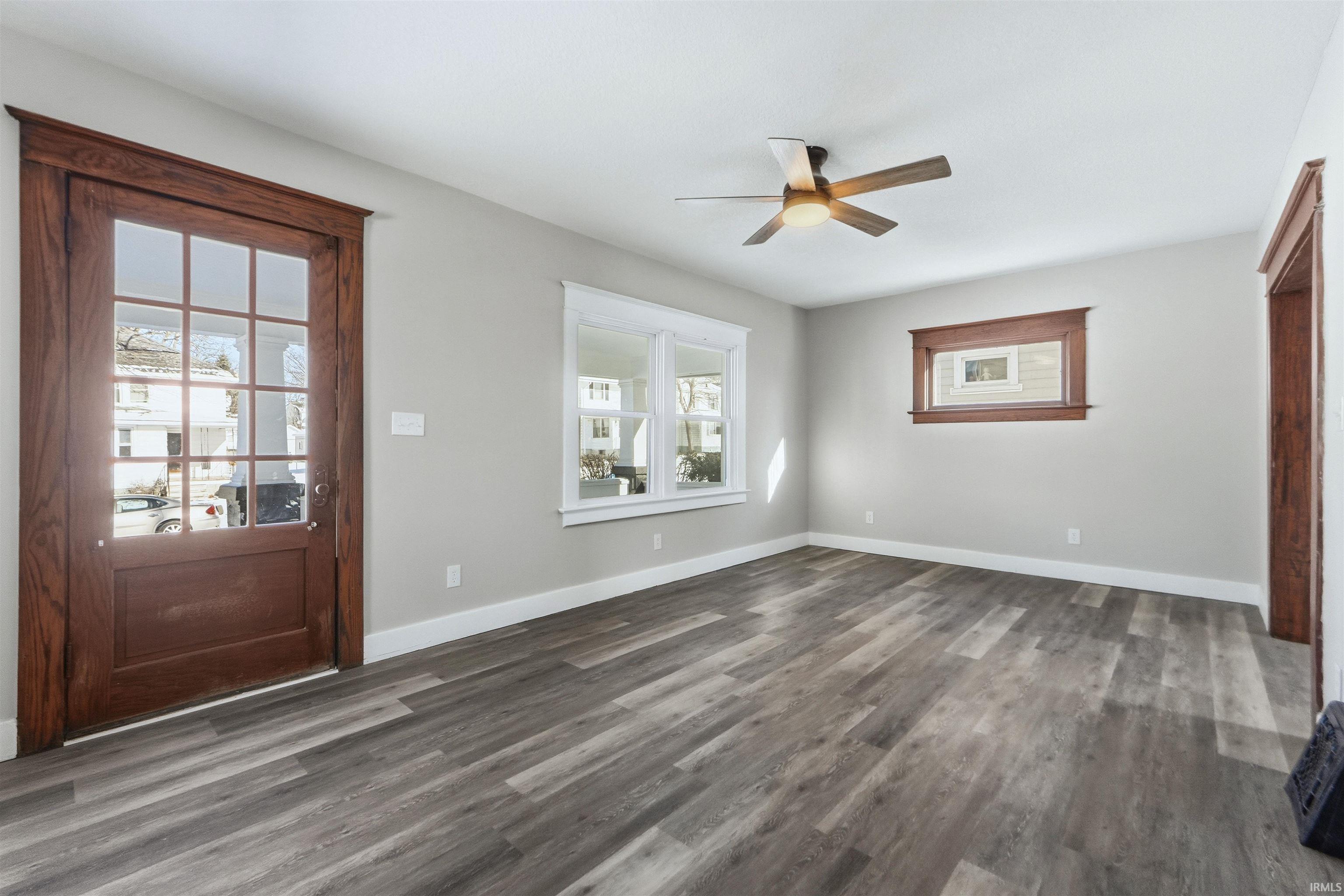 Entrance foyer featuring wood finished floors and ceiling fan
