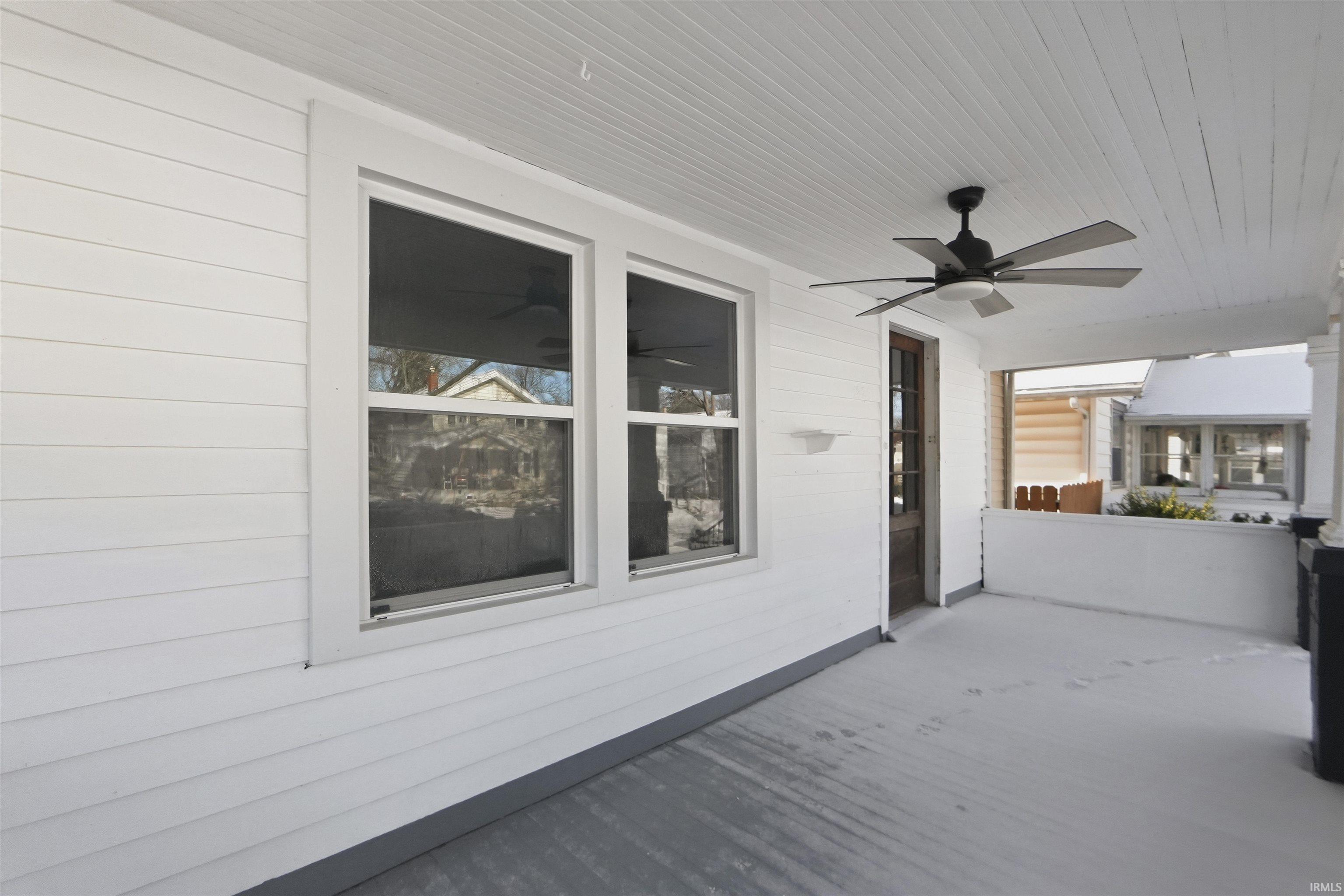 Wooden terrace with a ceiling fan