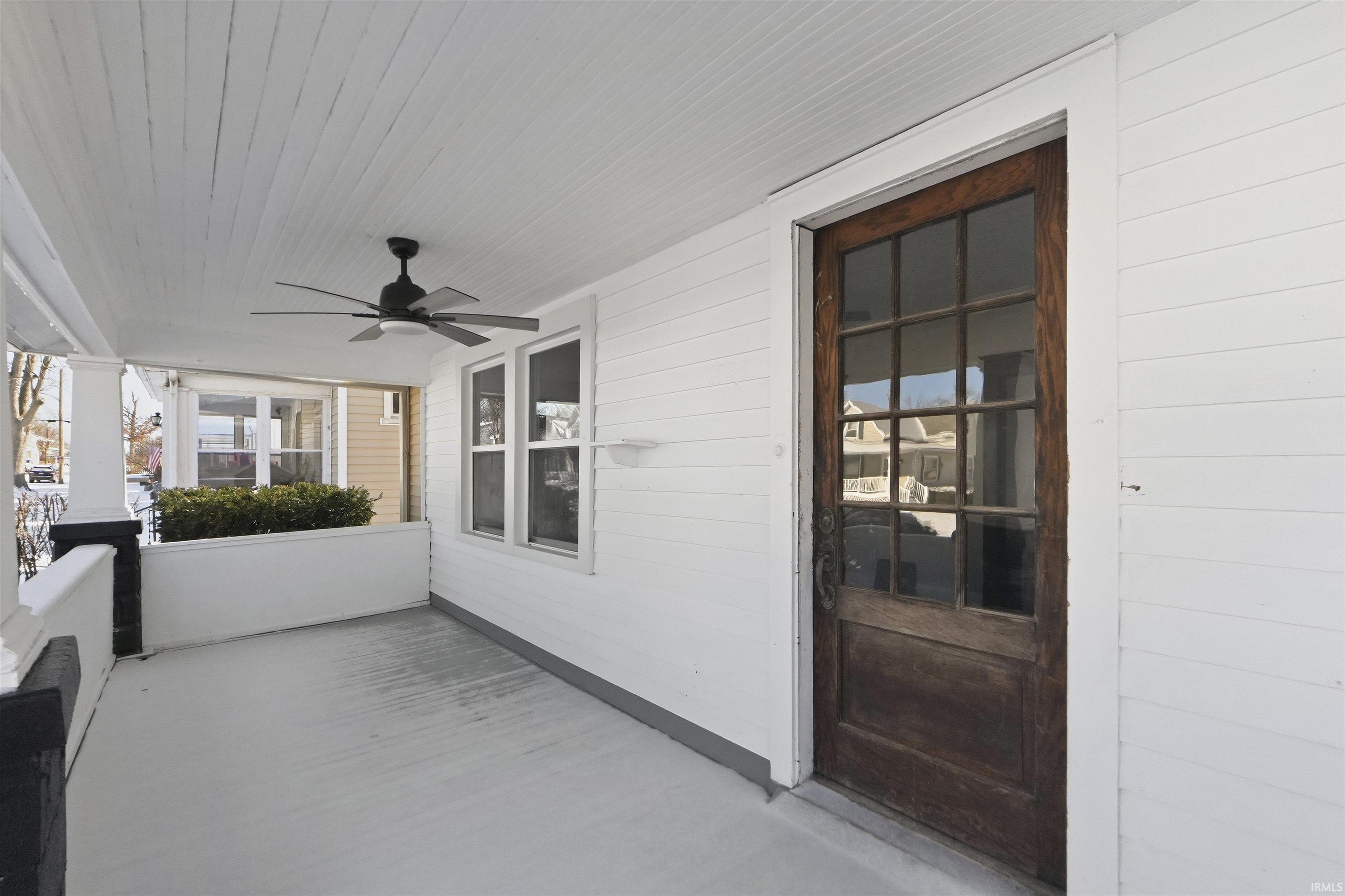 Covered porch with ceiling fan