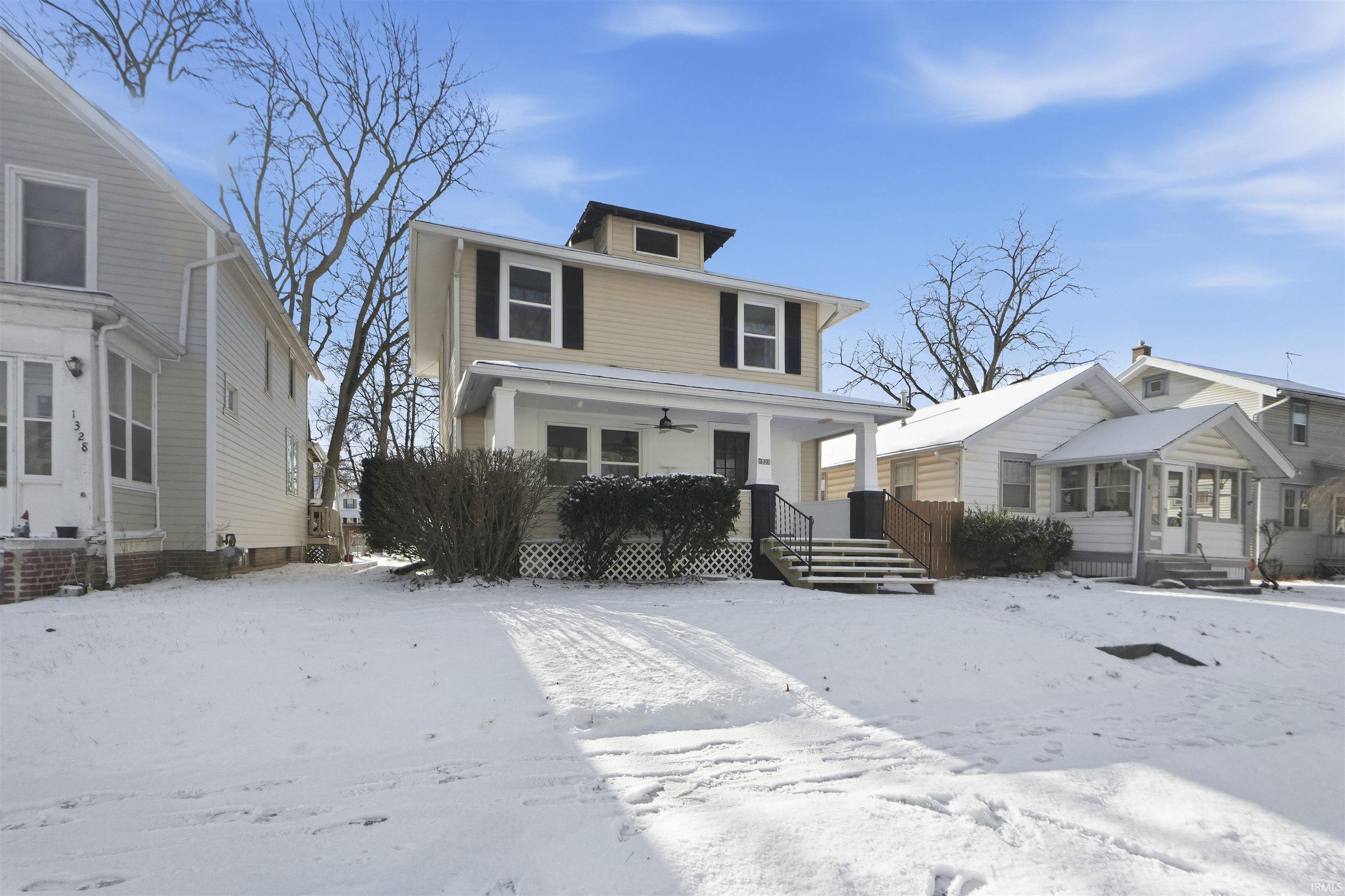 Traditional style home with covered porch