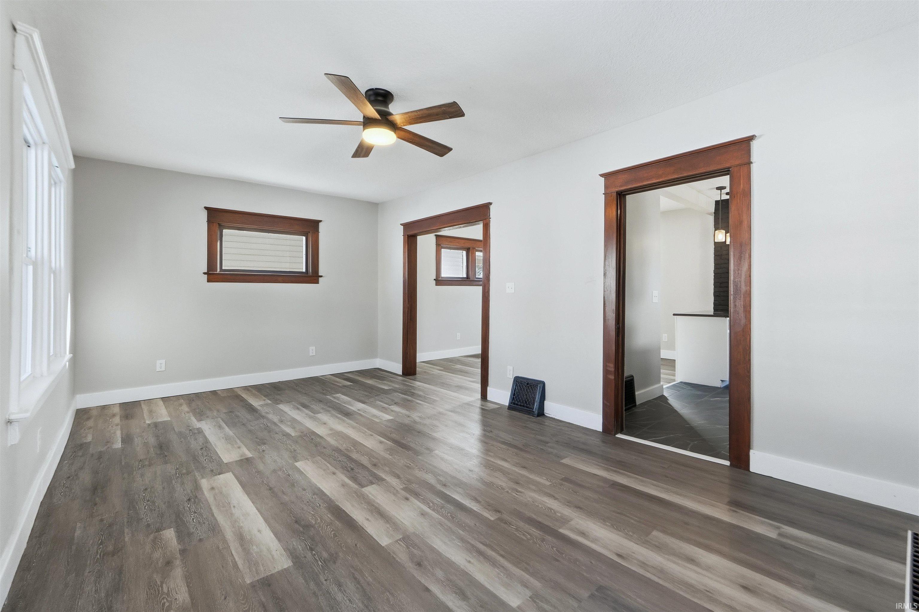 Unfurnished bedroom featuring a ceiling fan and wood finished floors