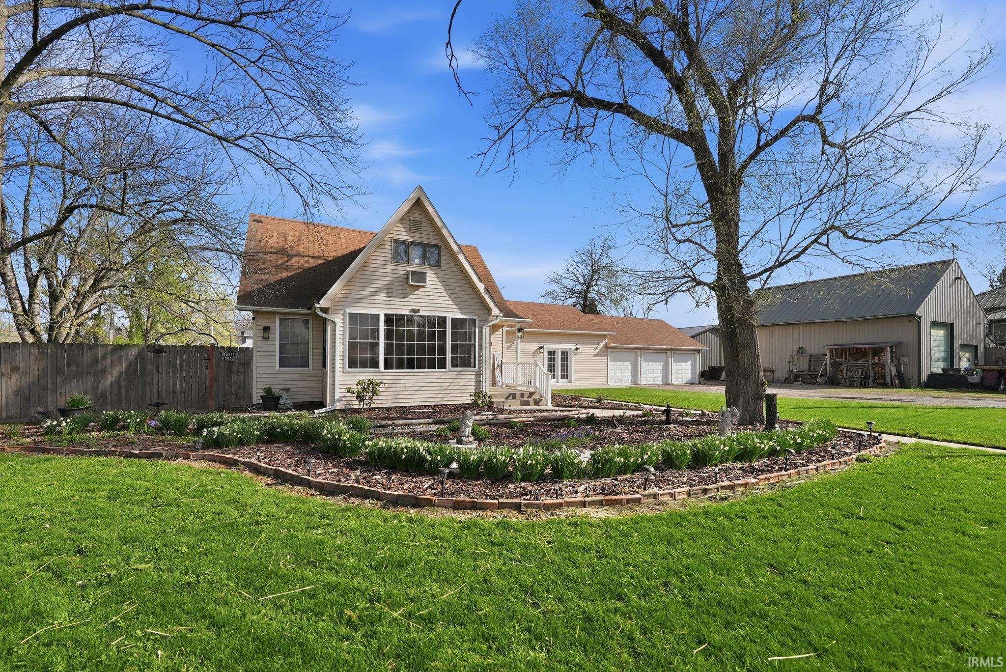 Back of property featuring driveway