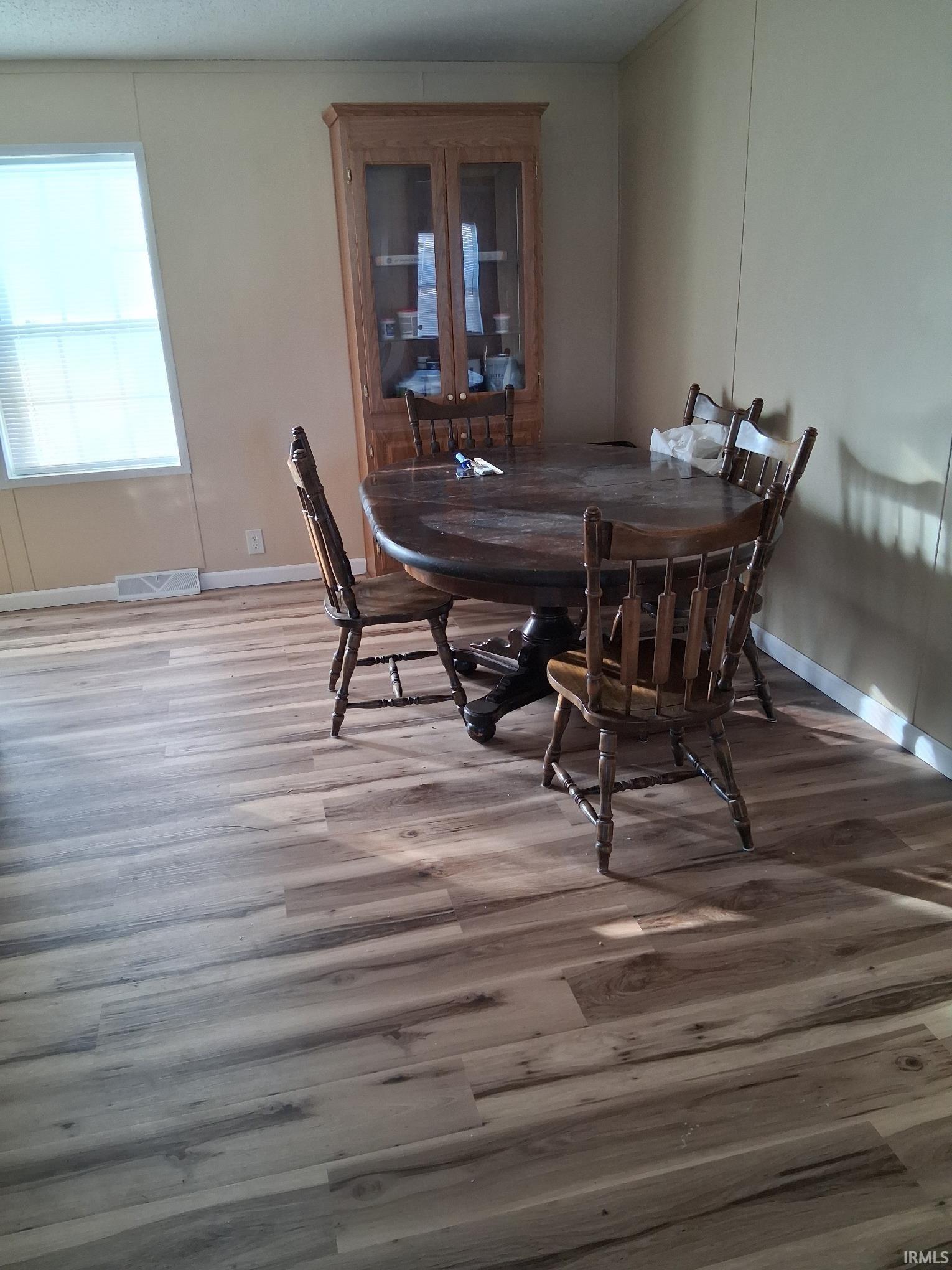 Dining space with new vinyl plank floors
