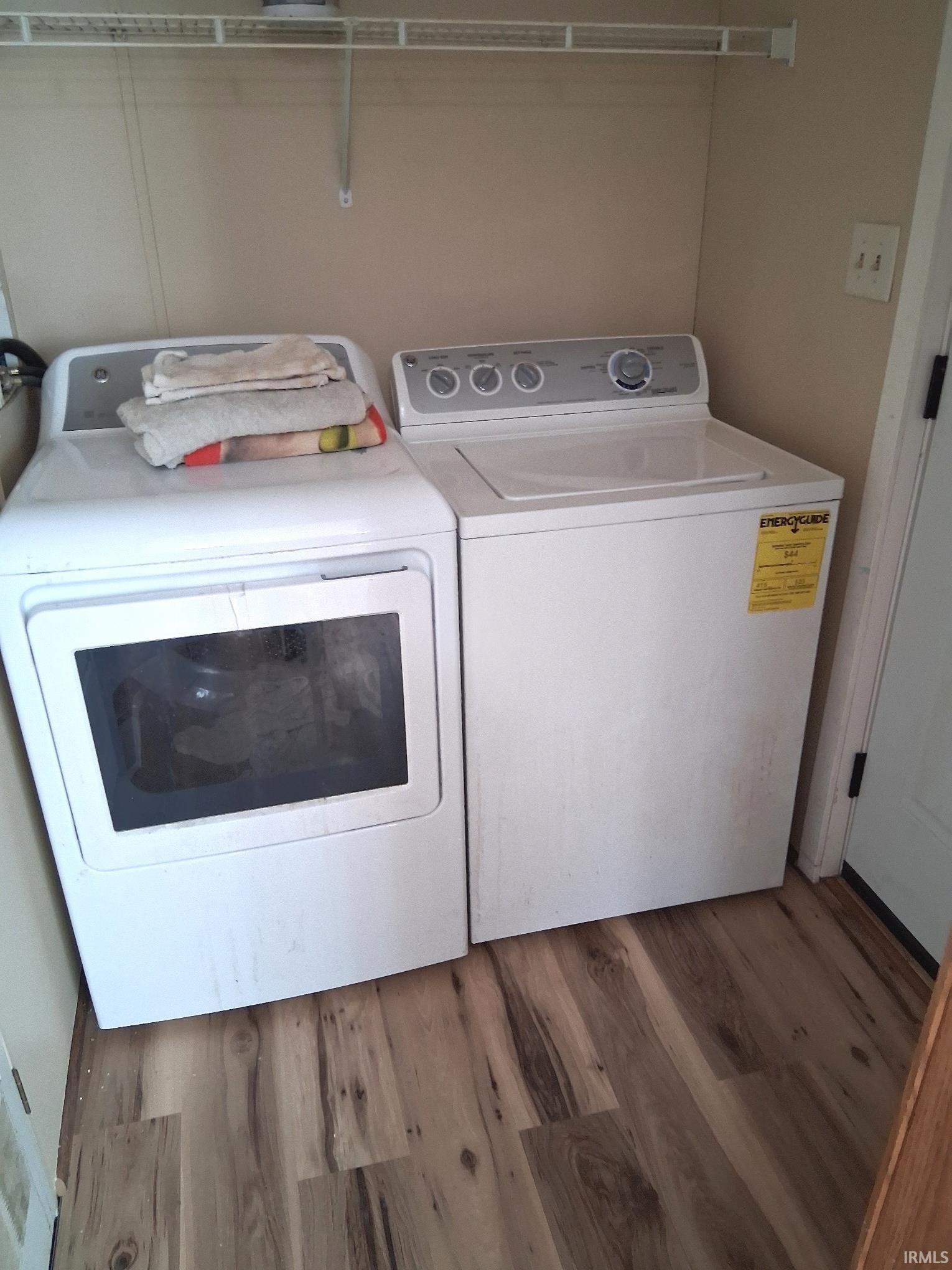LAUNDRY featuring NEW vinyl plank flooring and washing machine and dryer