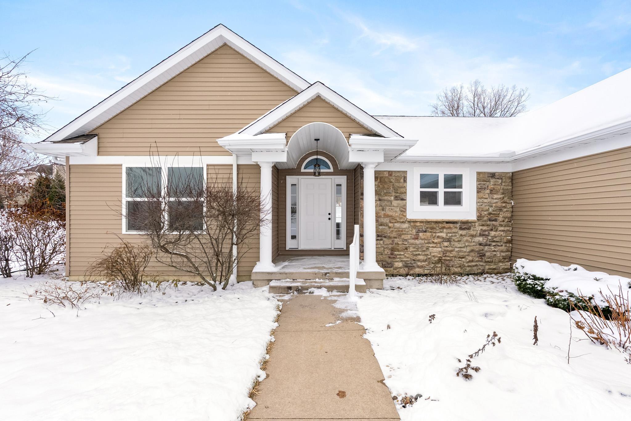 View of front of house featuring stone siding