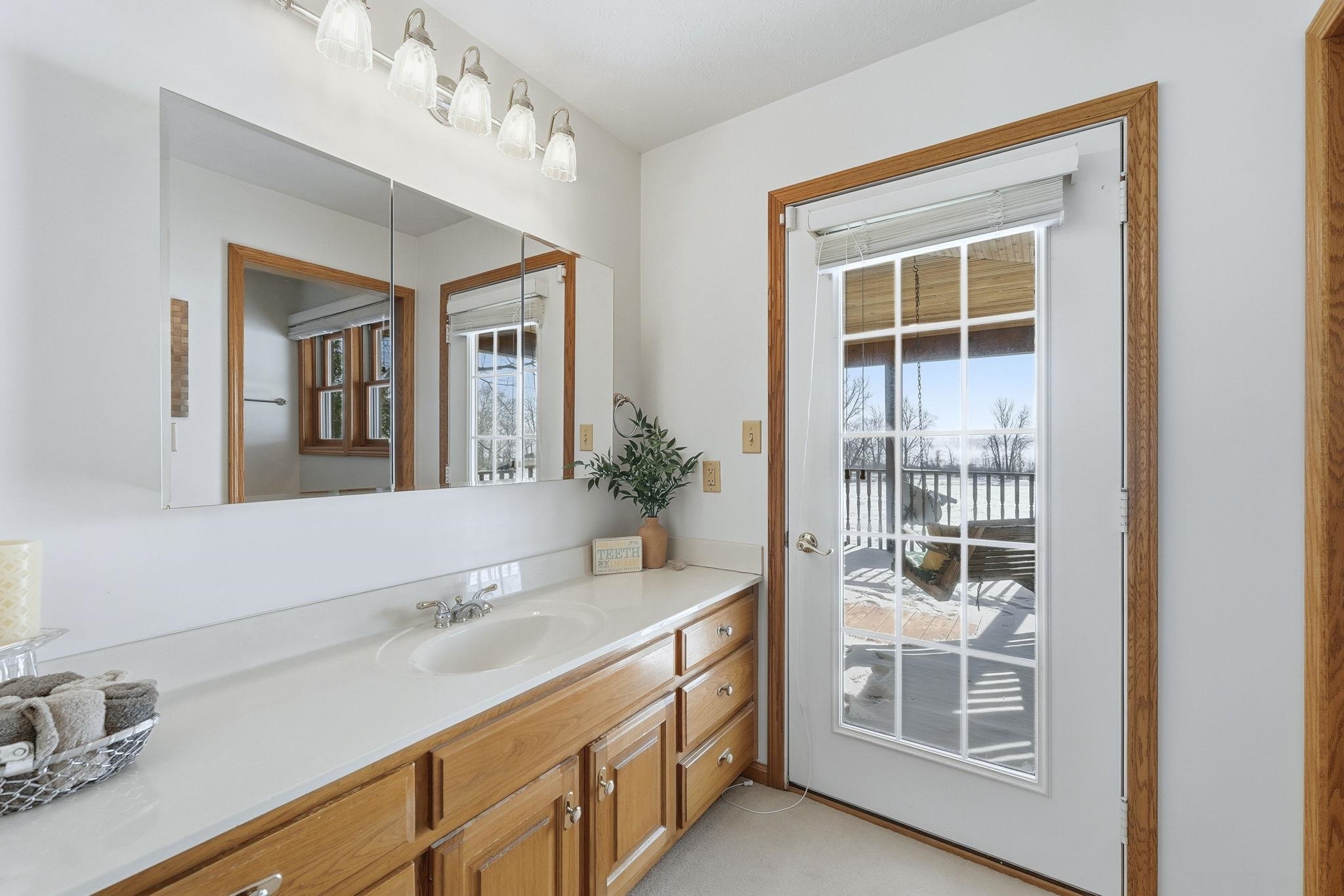 Bathroom featuring vanity and plenty of natural light