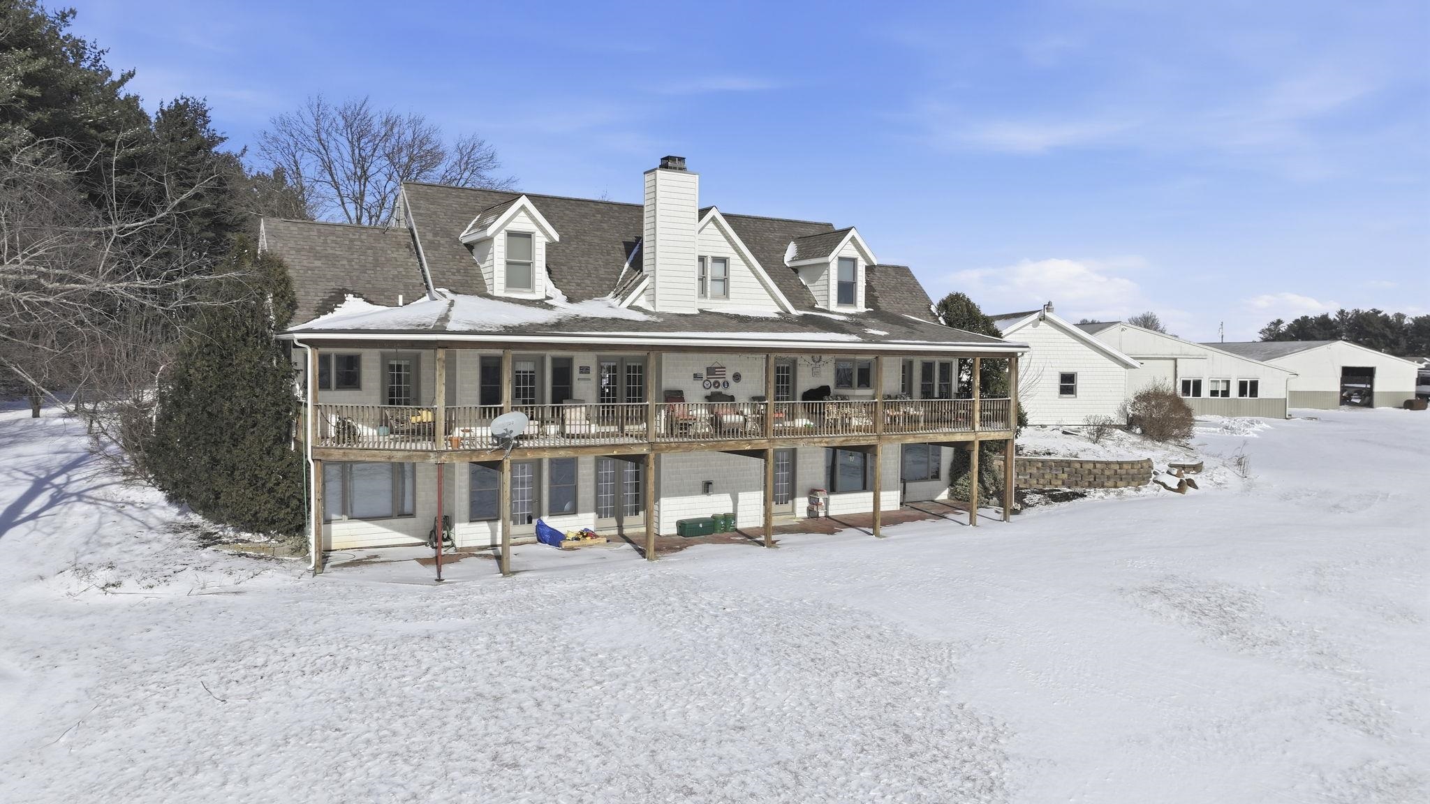 Snow covered house with a chimney