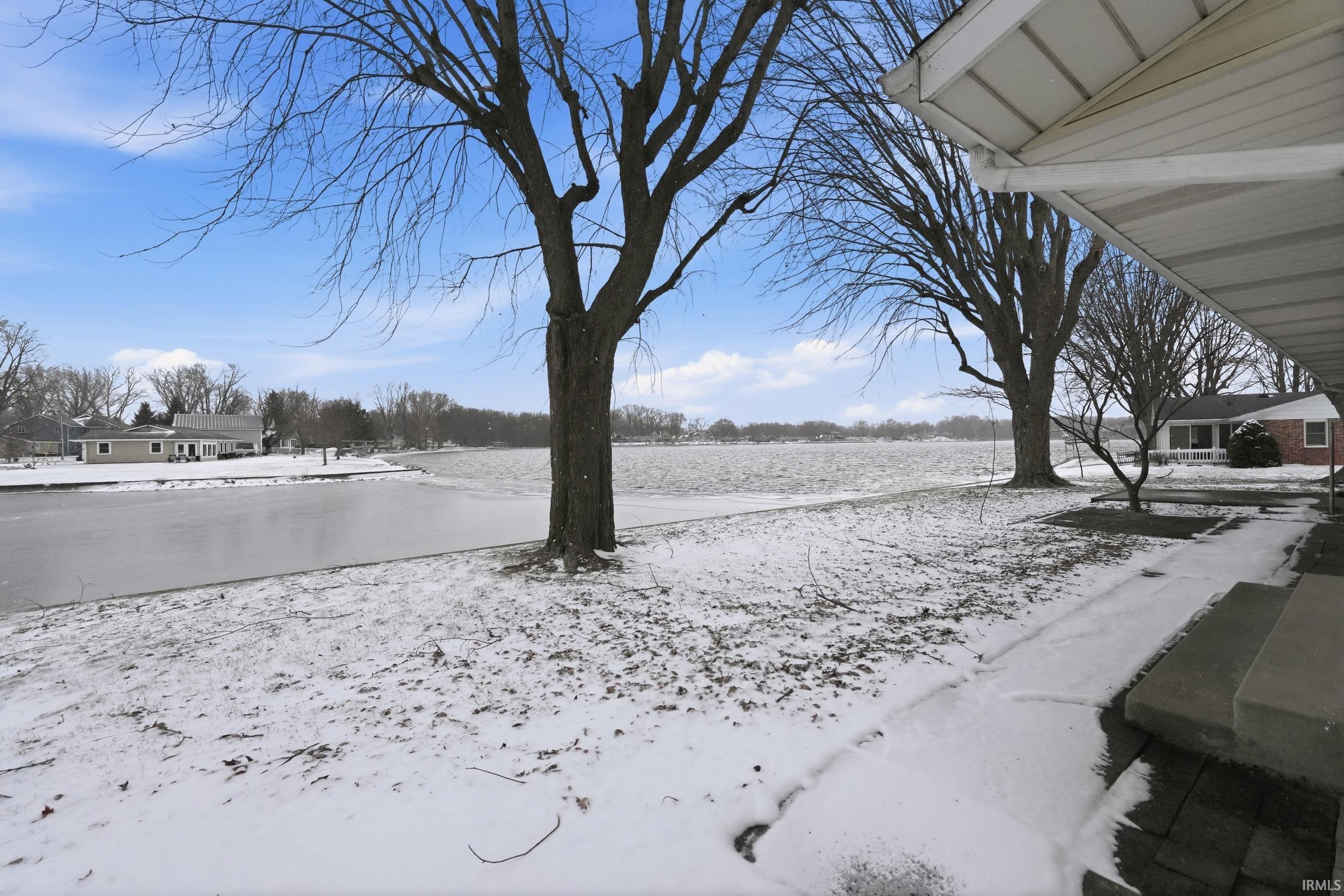 View of yard covered in snow