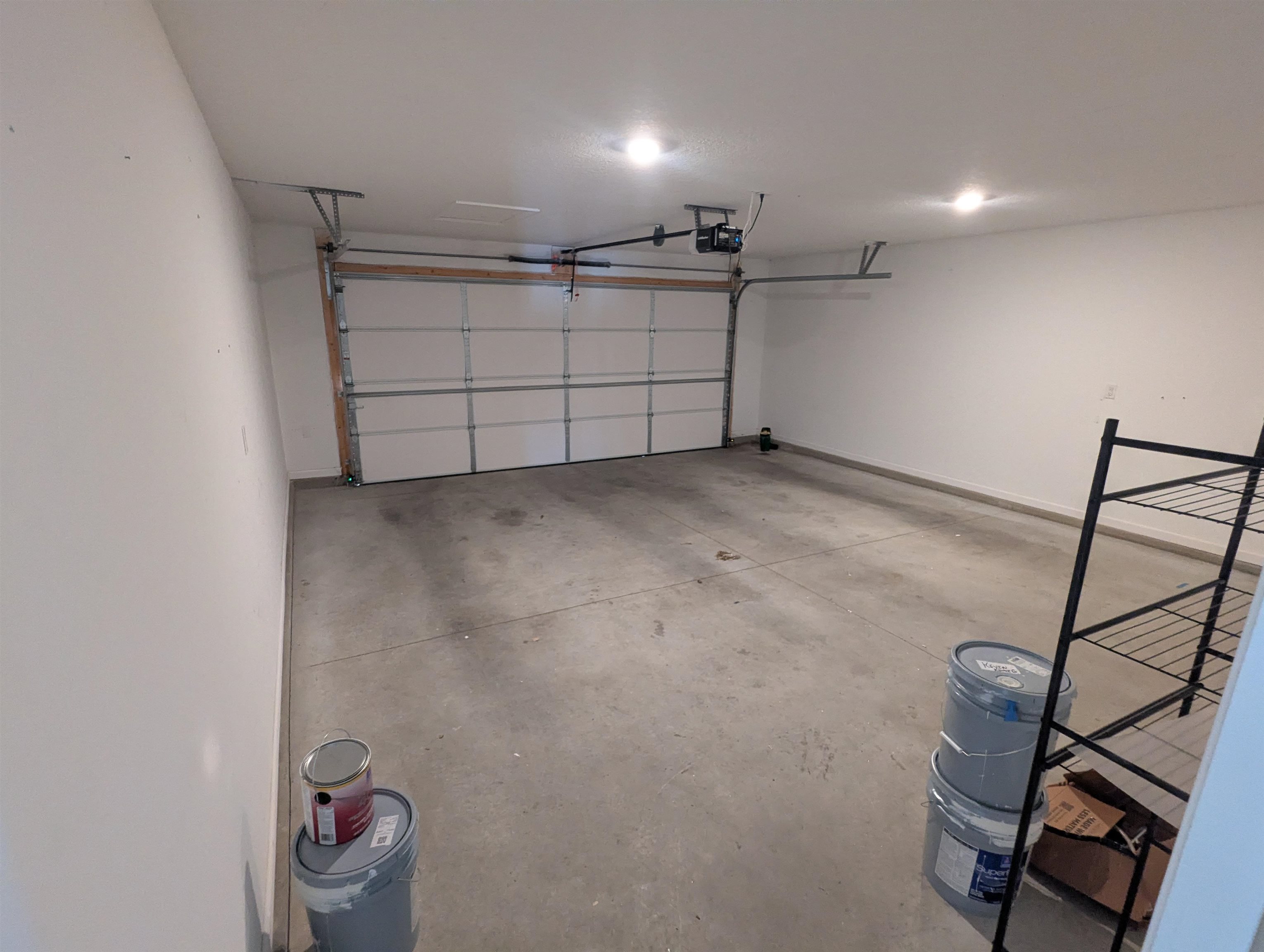 Garage featuring a garage door opener