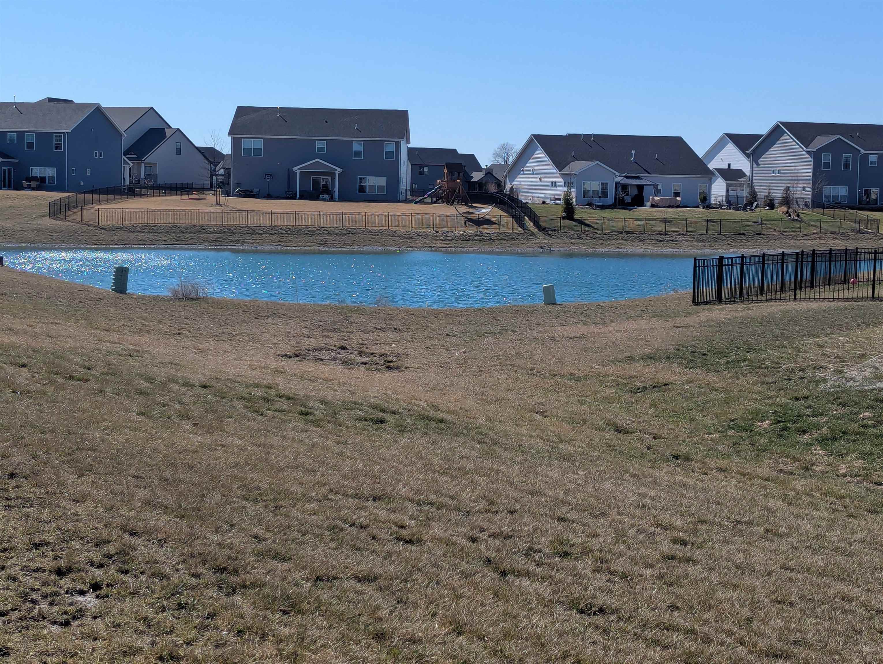 Water view featuring nearby suburban area