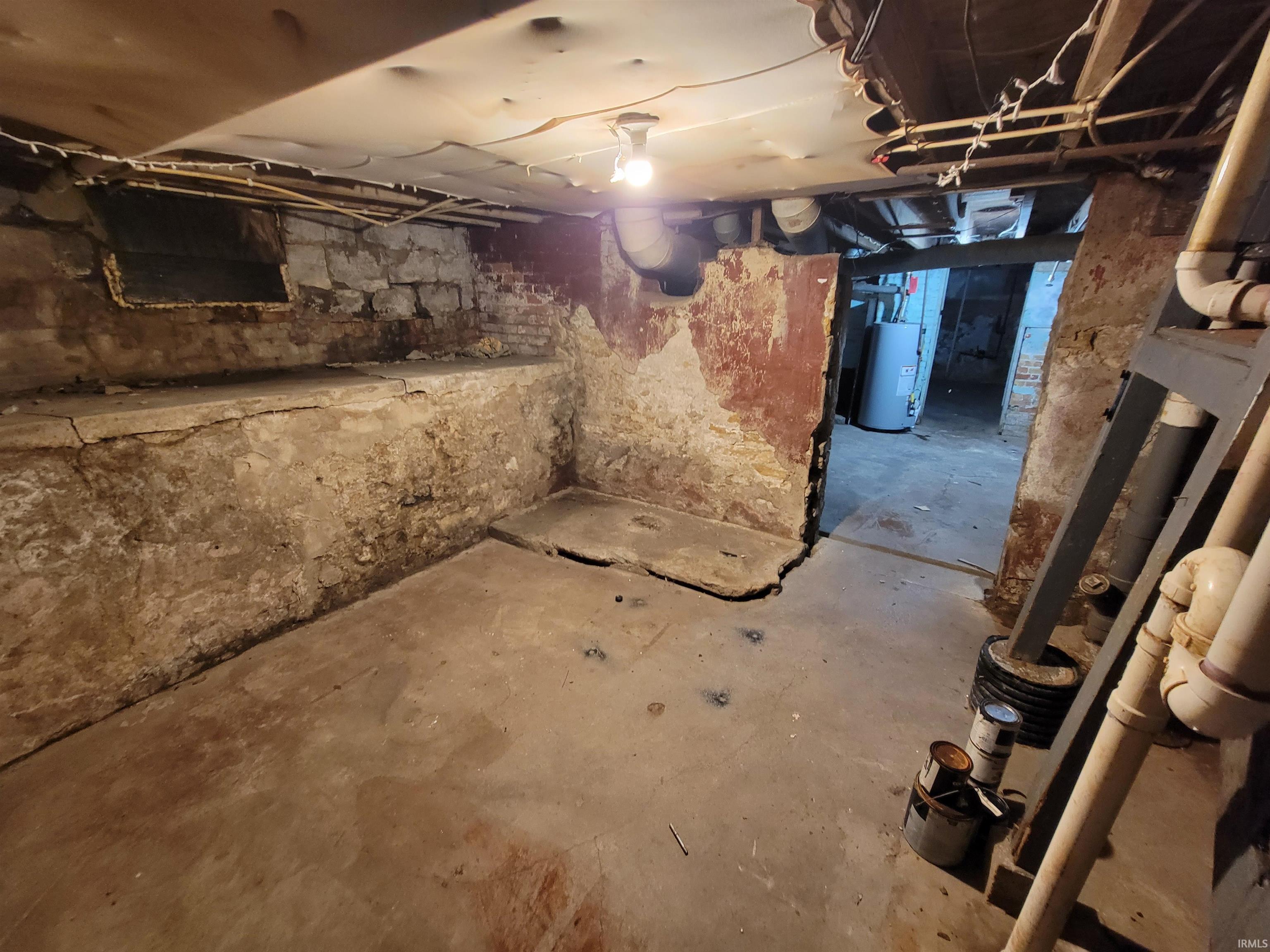 Unfinished below grade area with gas water heater