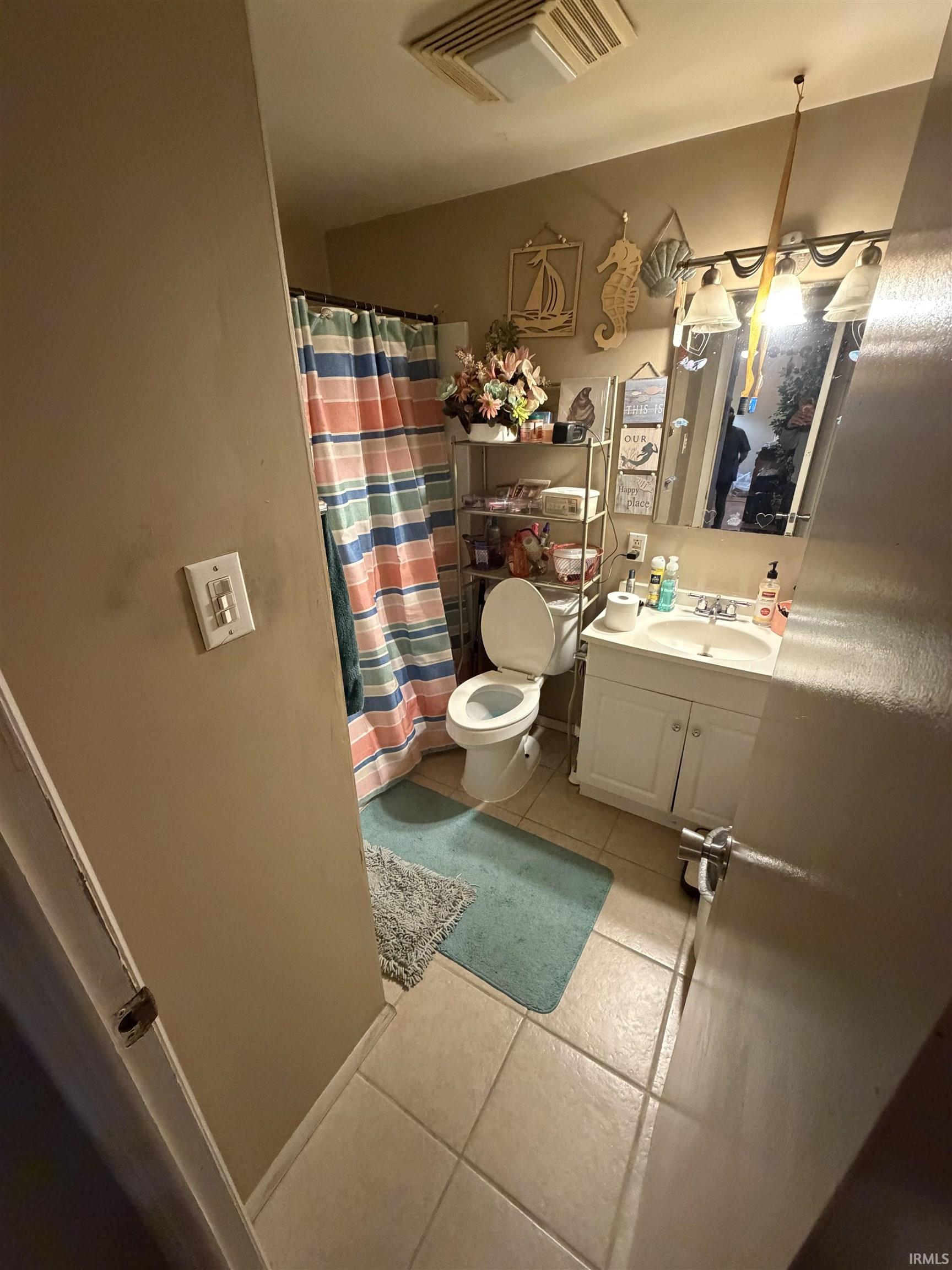 Full bath featuring light tile patterned floors, vanity, and cooling unit