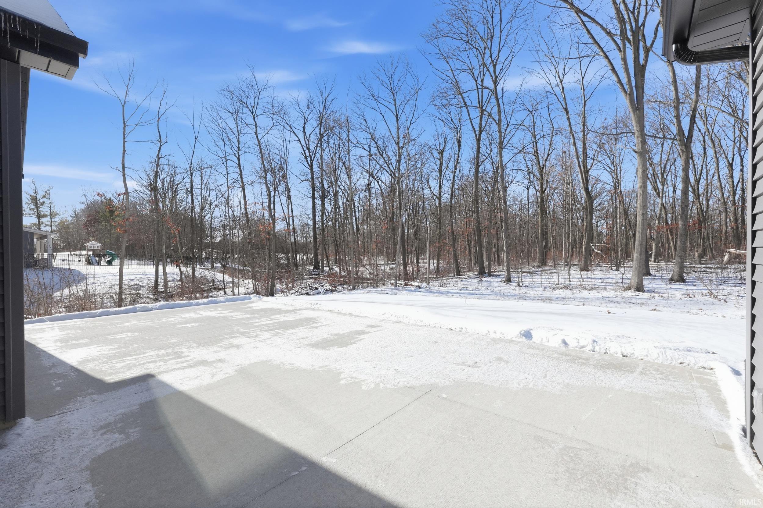 View of yard layered in snow