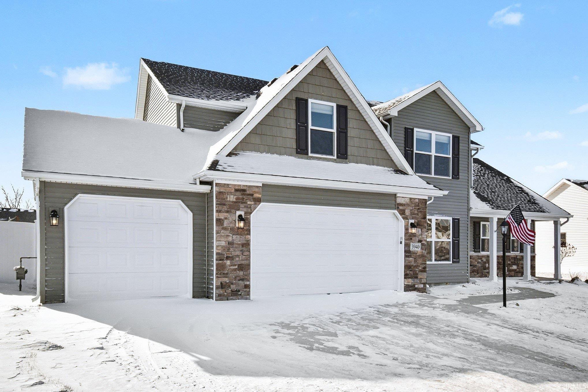 View of front of property with stone siding