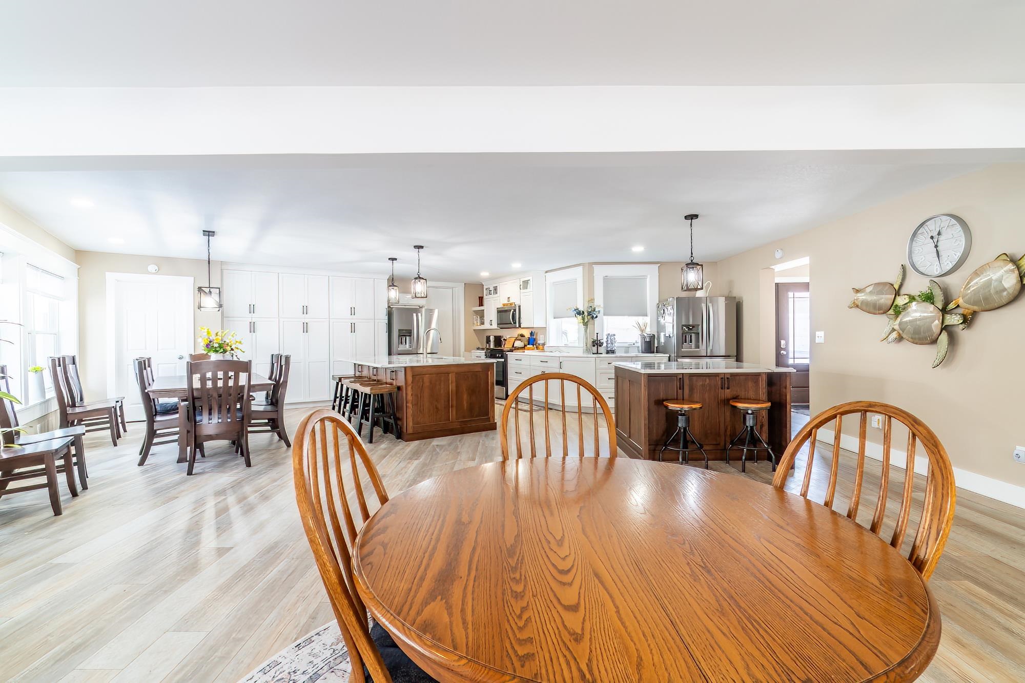 Dining space with light wood-type flooring and recessed lighting