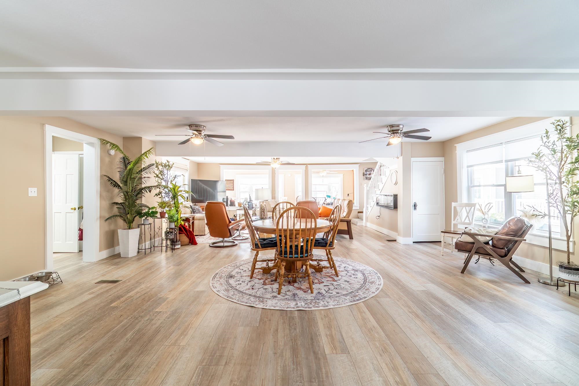 Dining area featuring light wood-style floors and healthy amount of natural light