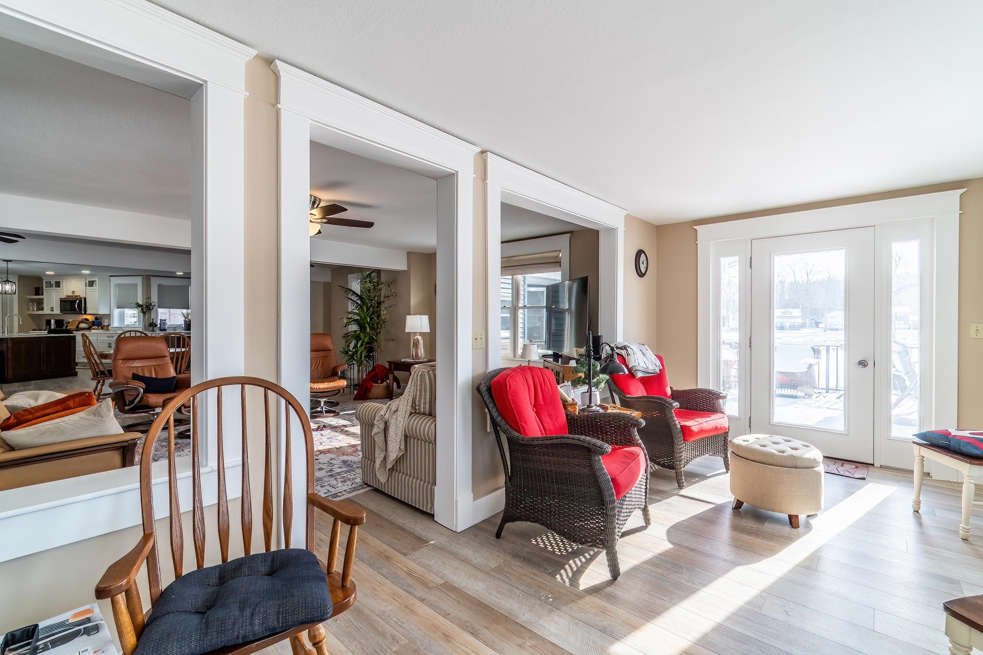 Sitting room featuring wood-type flooring and ceiling fan