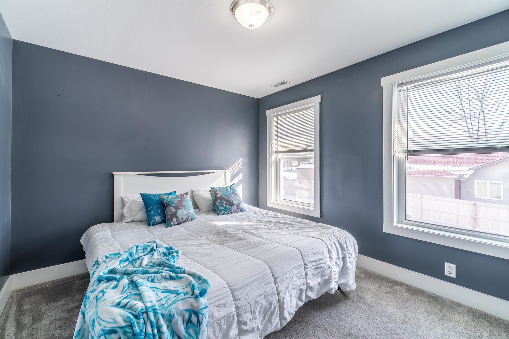 Bedroom with carpet and baseboards