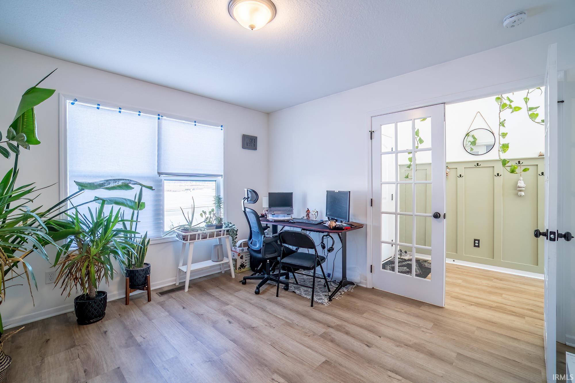 Office featuring light wood-style flooring and plenty of natural light