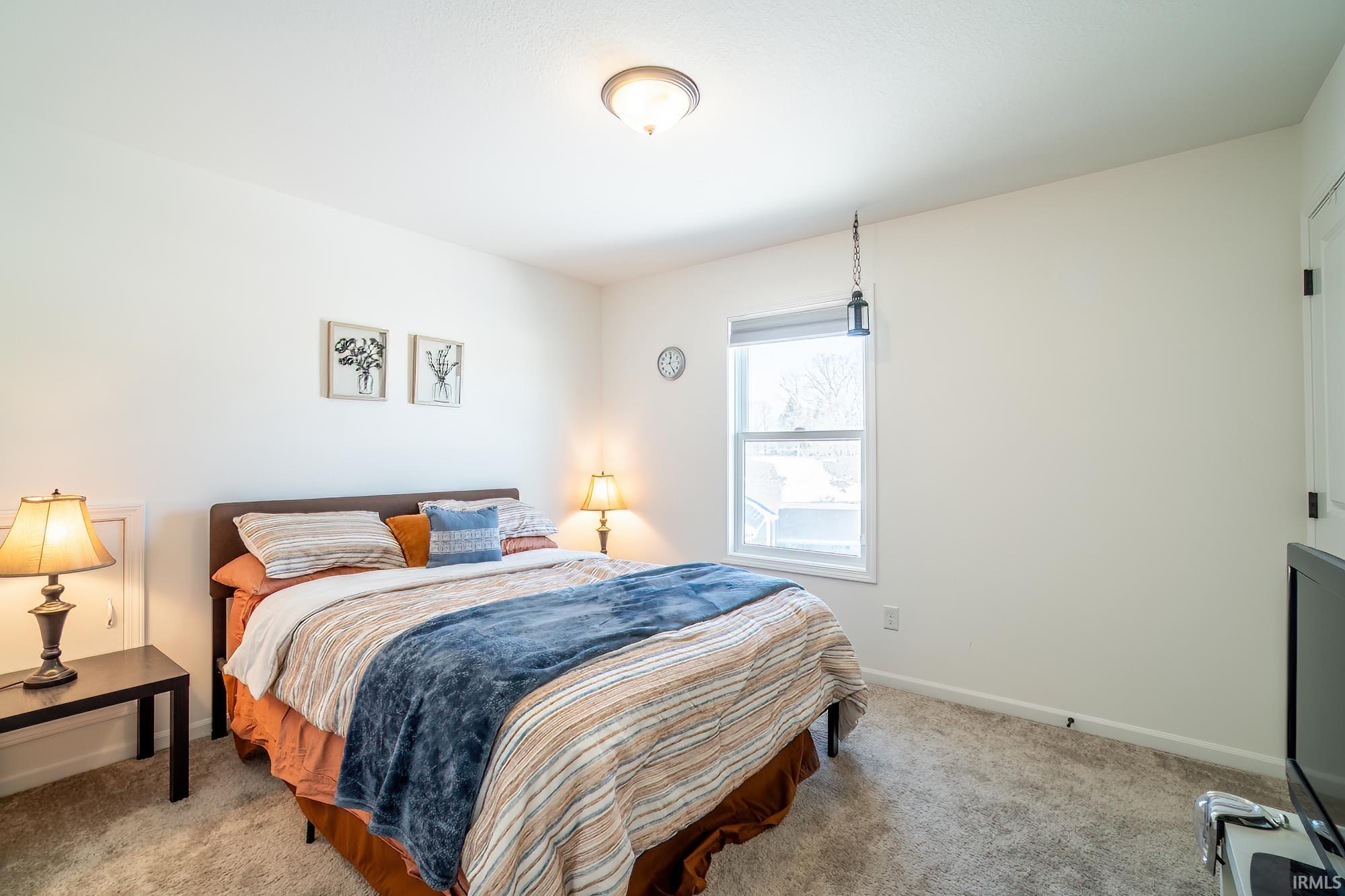 Bedroom featuring carpet flooring