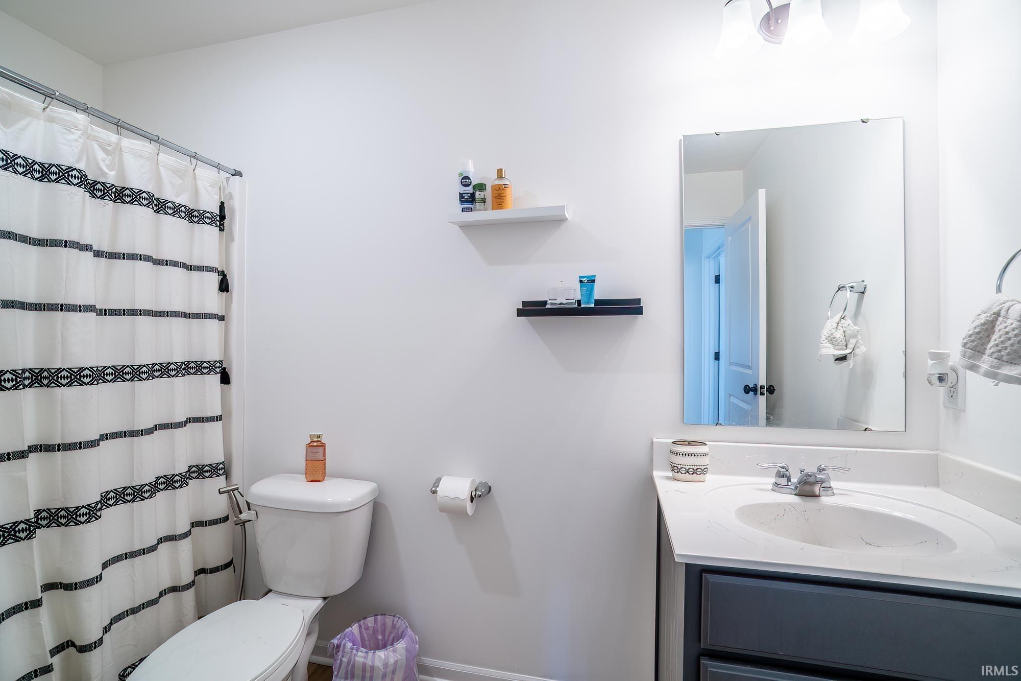 Bathroom with vanity and a shower with curtain
