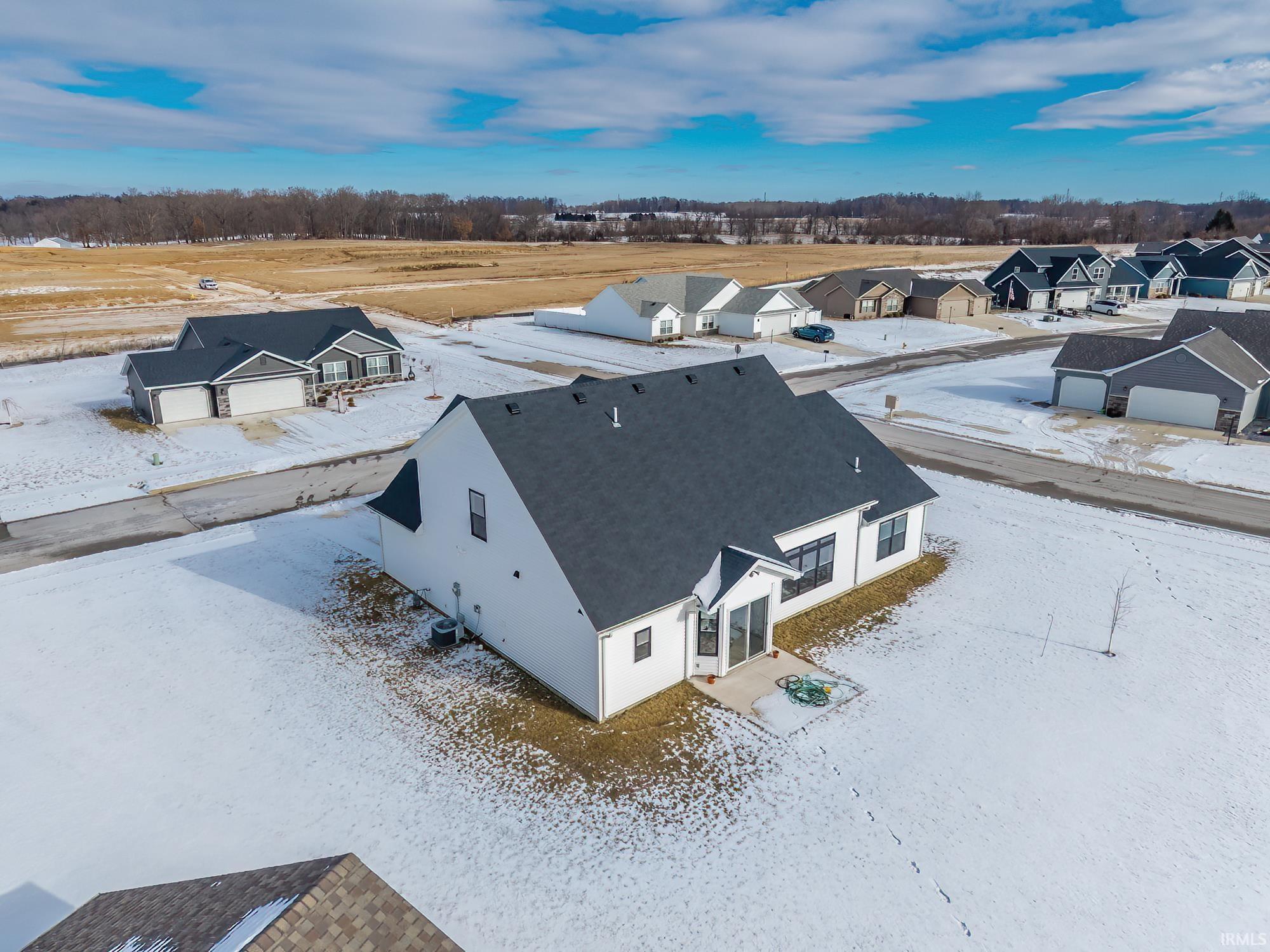 Snowy aerial view with a residential view
