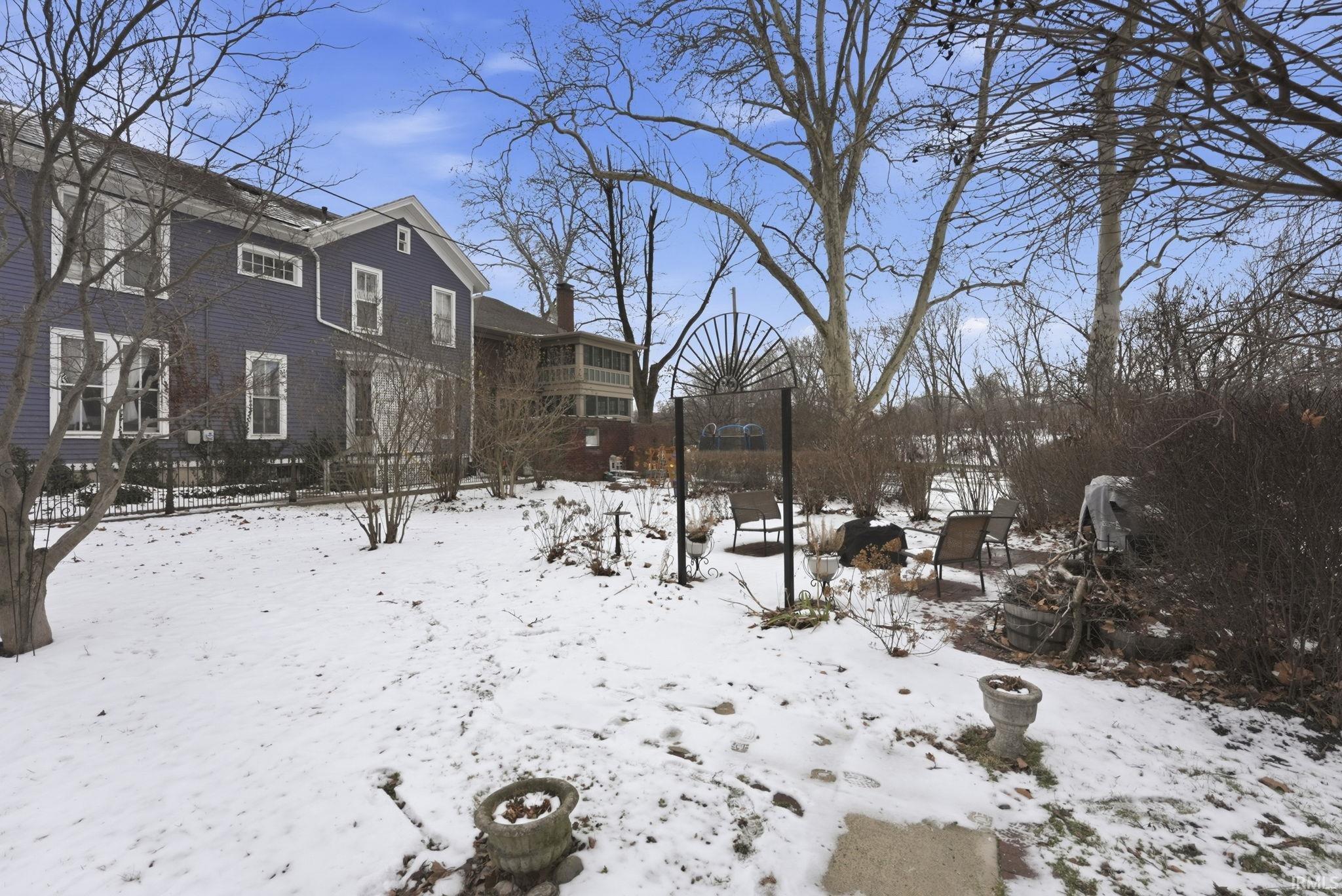 View of yard layered in snow