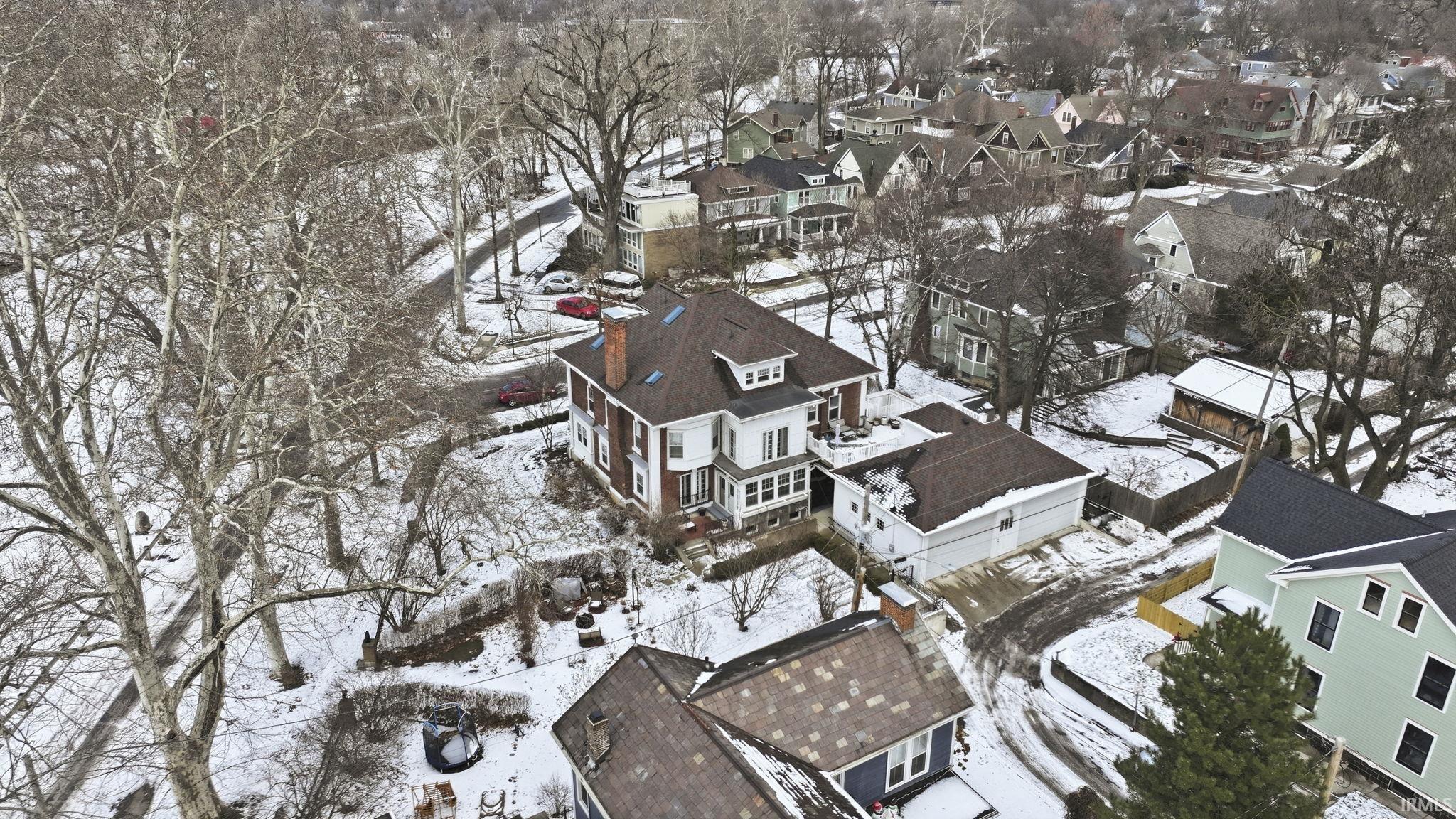 Snowy aerial view featuring a residential view