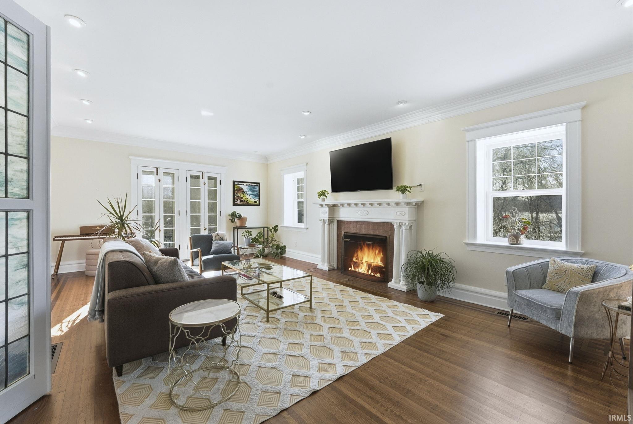 Formal sitting room with hardwood floors and fireplace