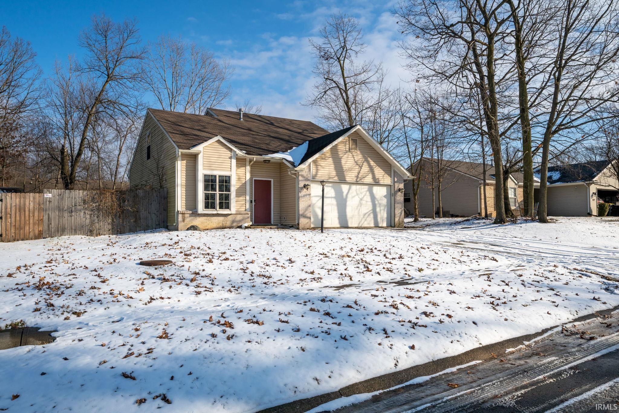 View of front of home featuring a garage