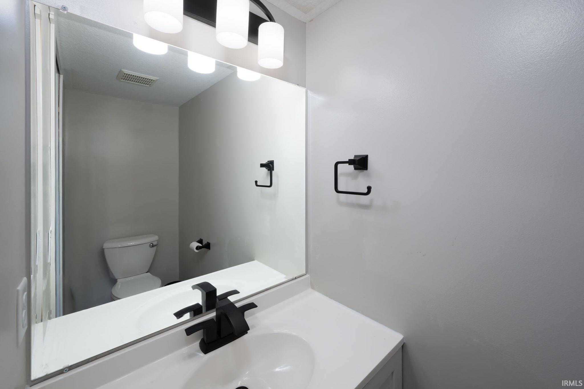 Bathroom featuring toilet and vanity
